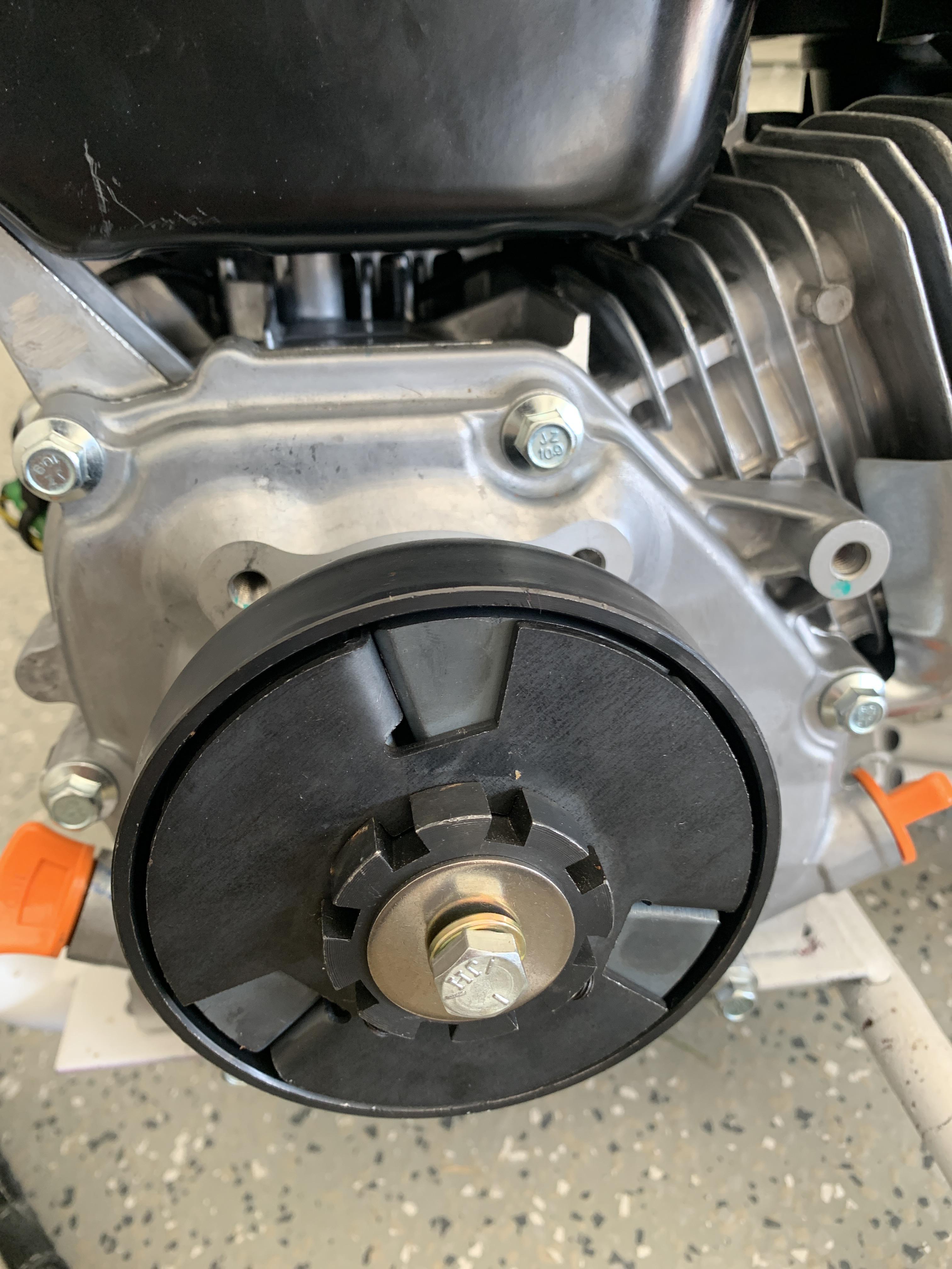 How tight should my clutch bolt be. Does the clutch still have to spin