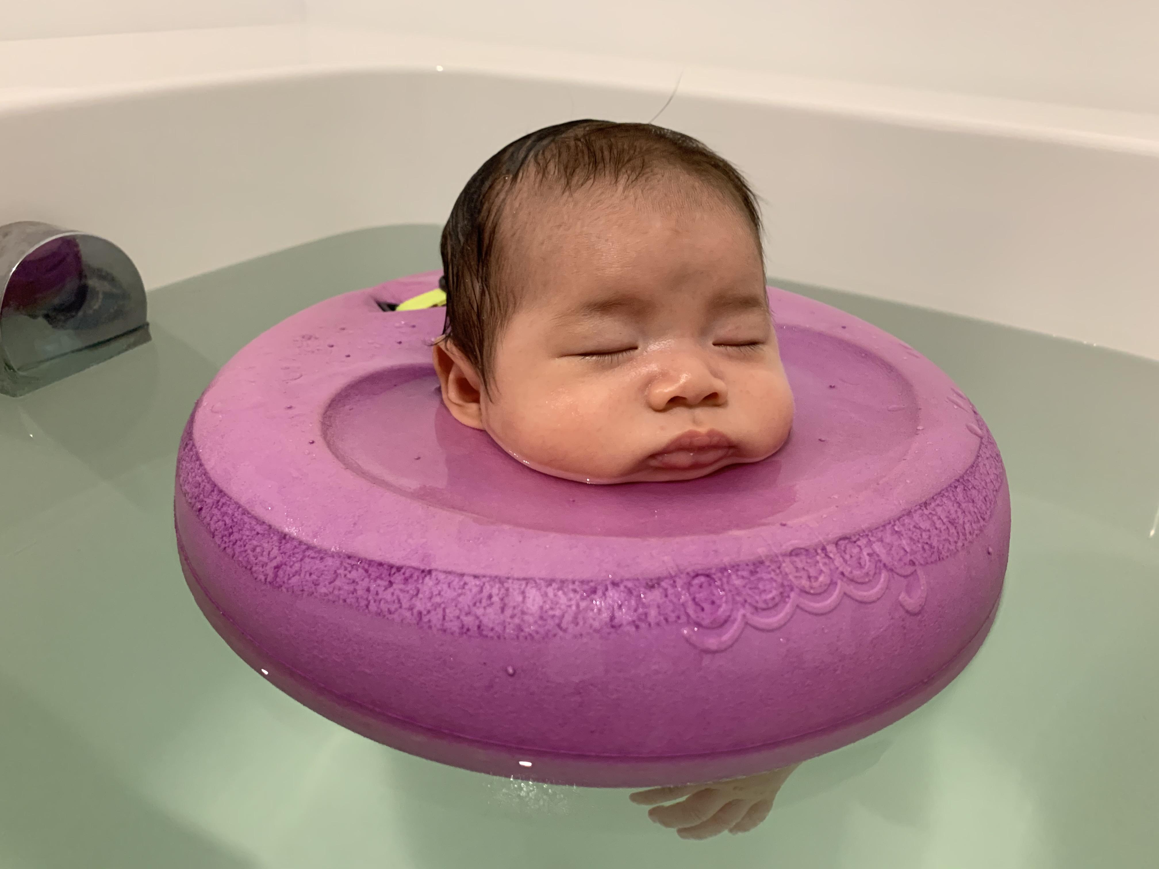 PsBattle Baby floating in a donut floaty.