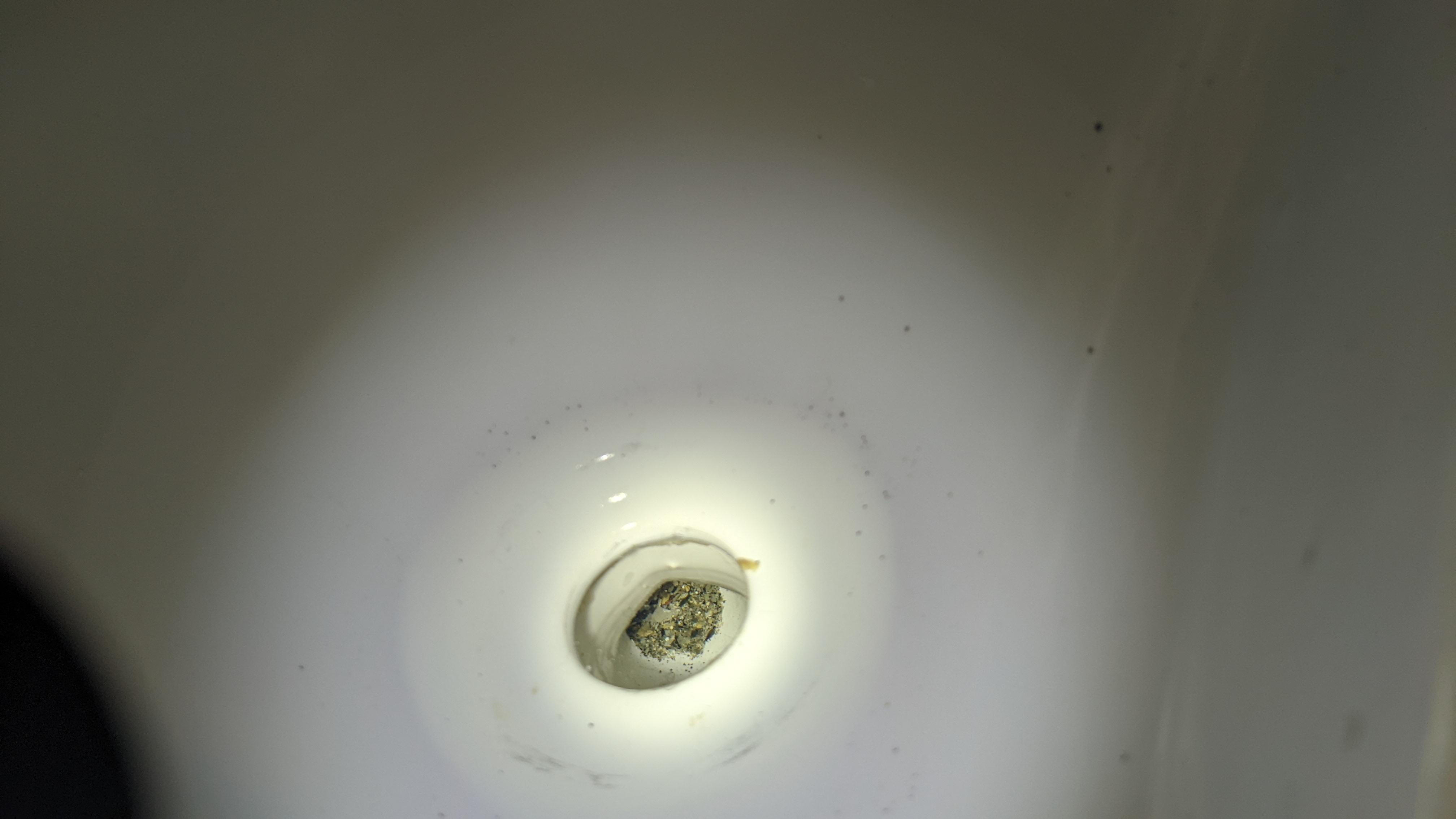 Did someone put sand in this urinal? Or is this some kind of sediment