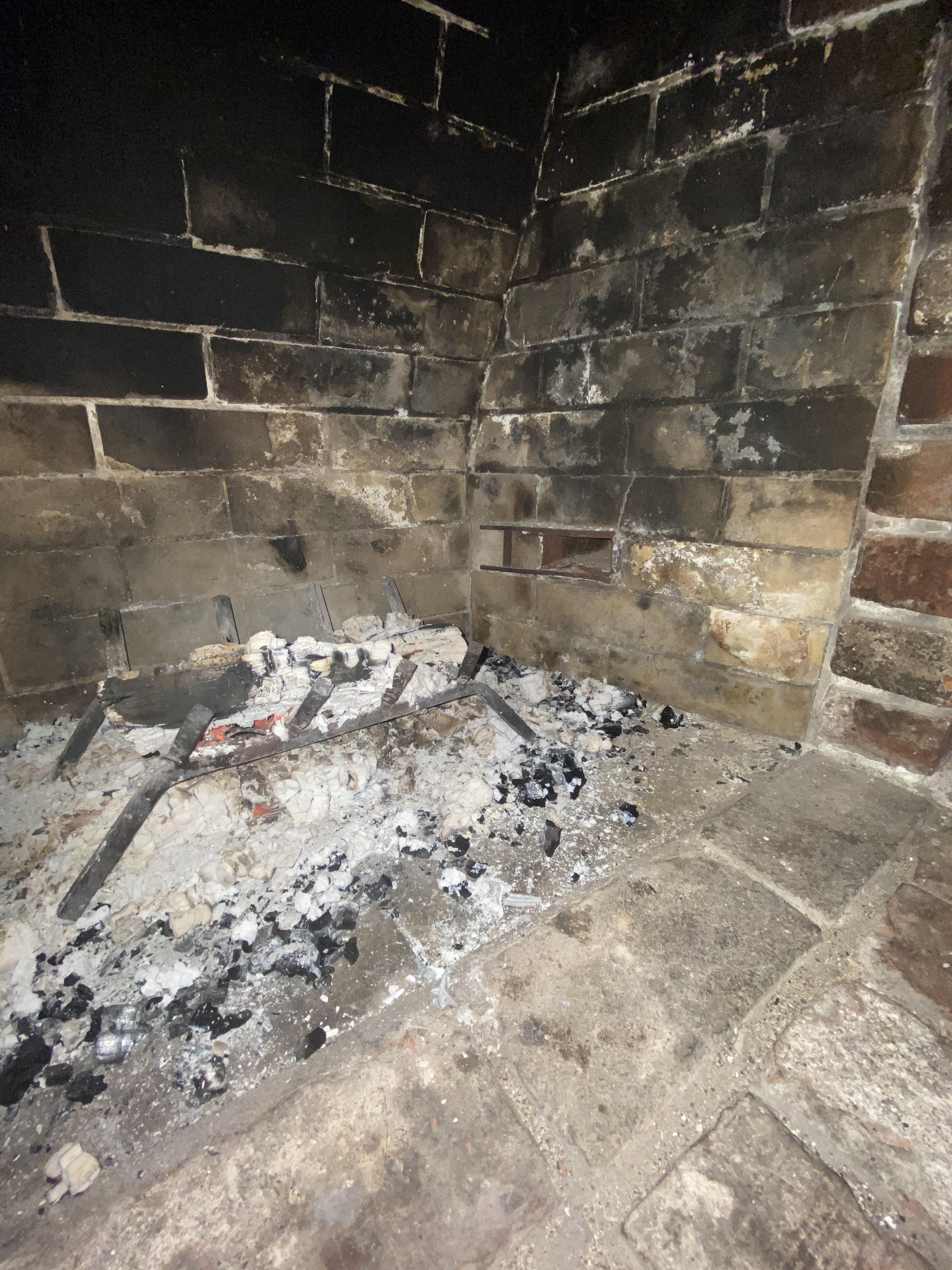 Not sure what this metal box in the side of my fireplace is. Can