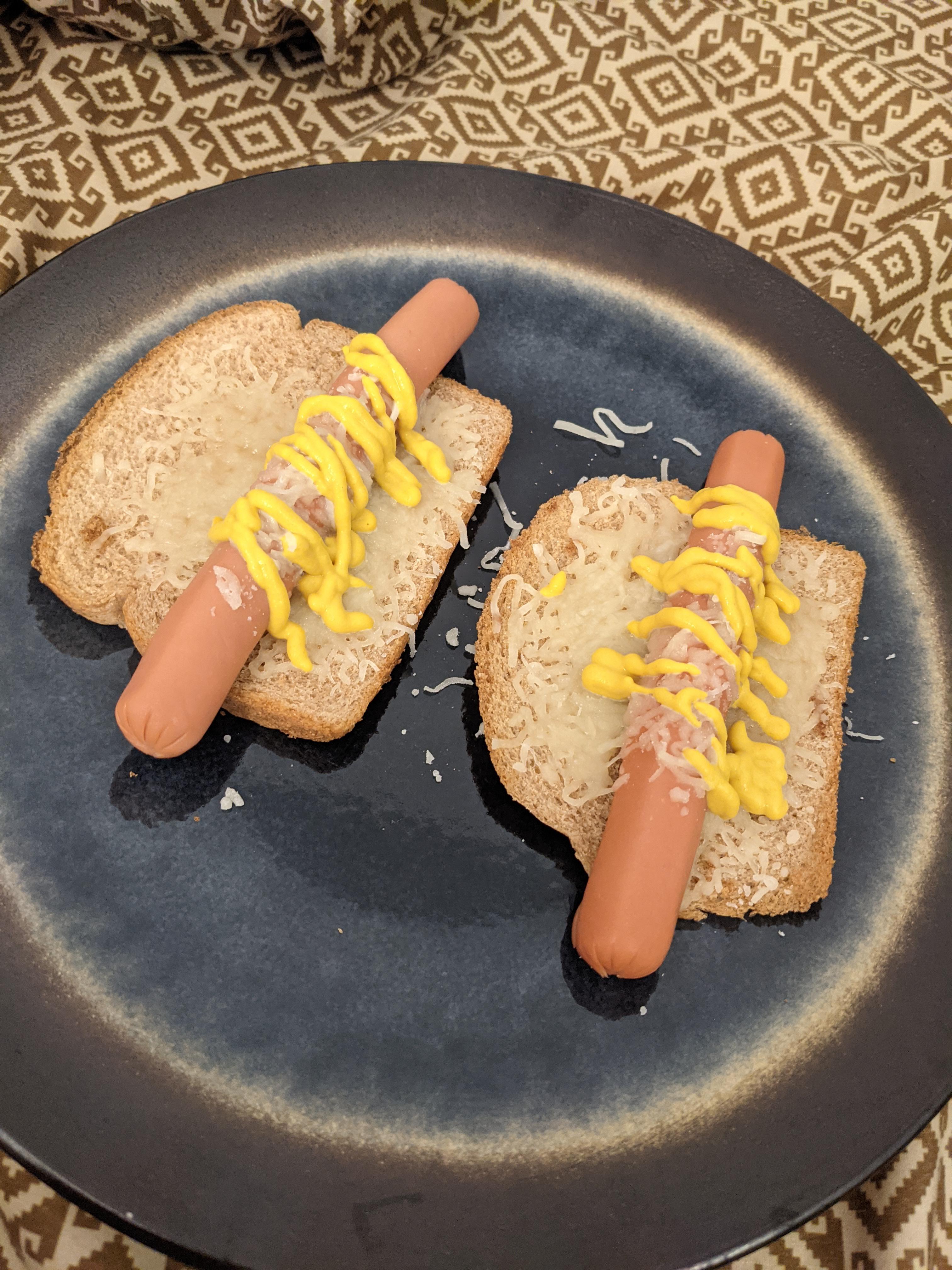 Microwaved hot dogs with bread ends, served in bed. r/shittyfoodporn