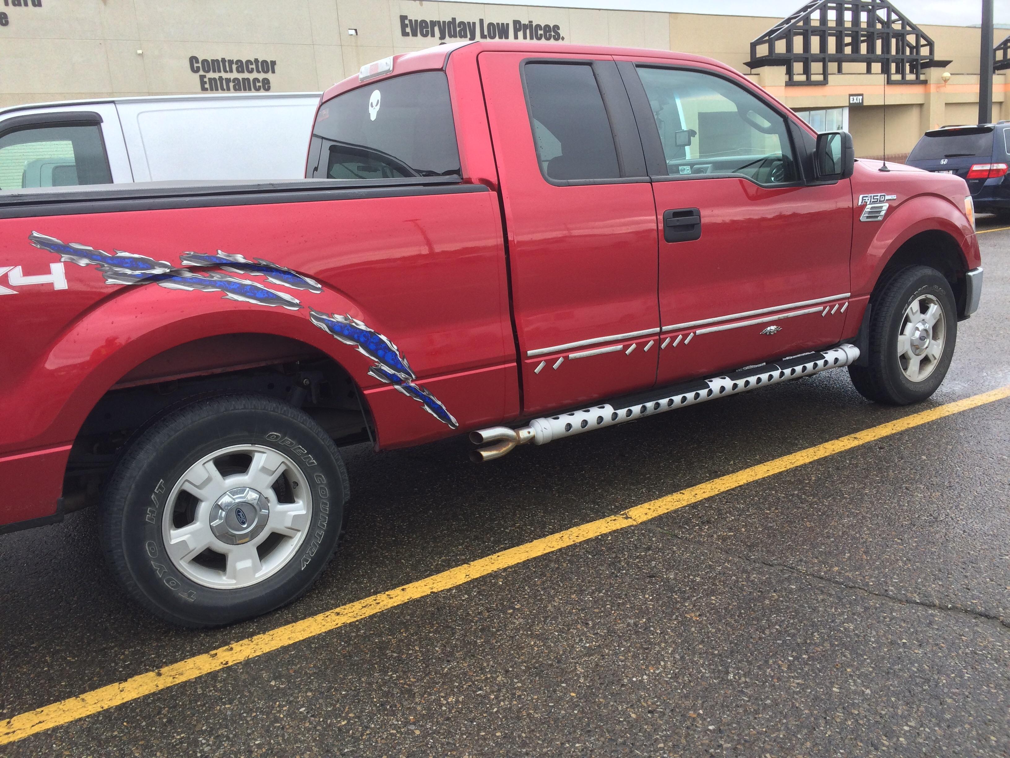 Not sure what's worse; the fake sidepipes or the little chrome bits