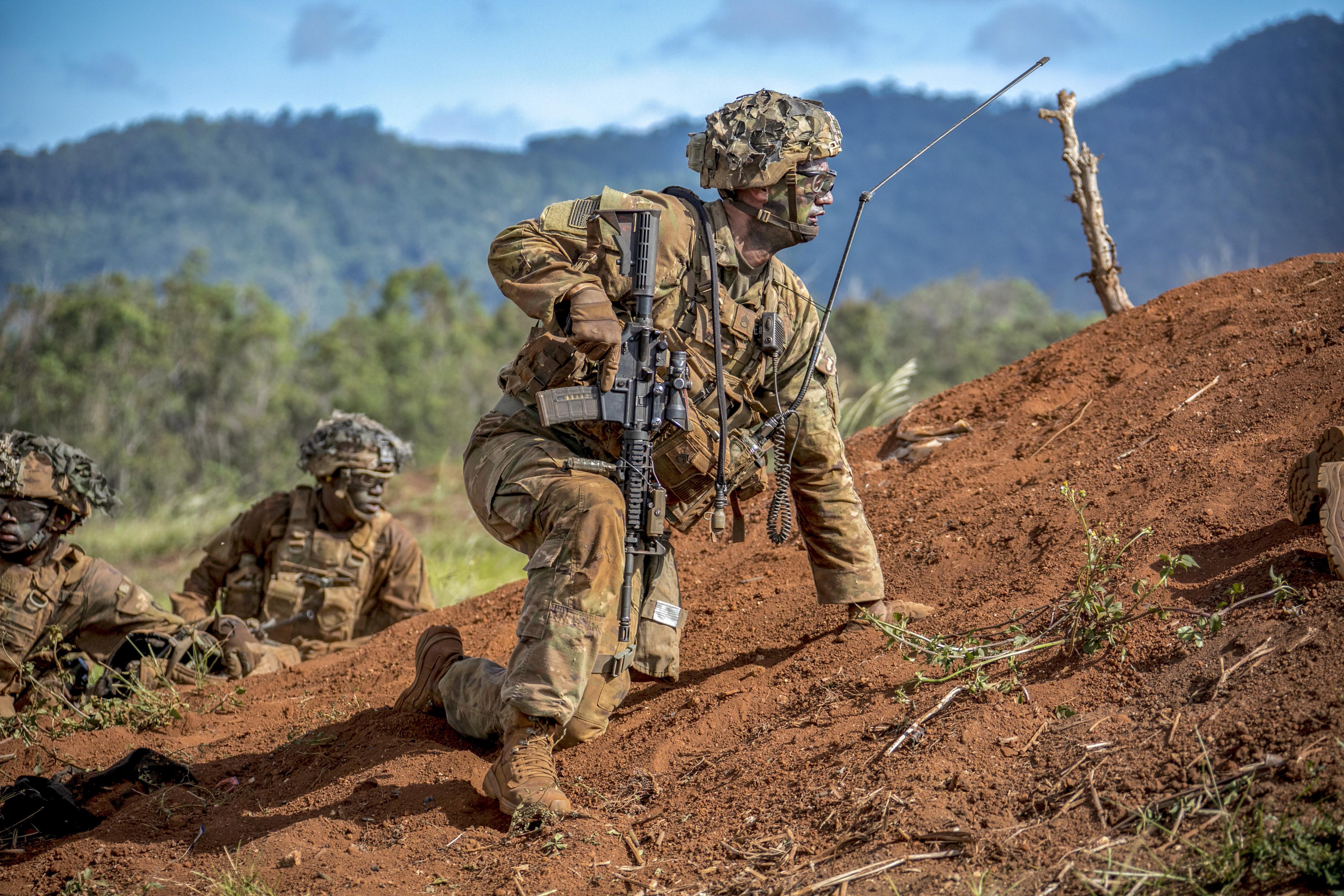 Army Staff Sgt. Christopher Doyle prepares to move forward during a