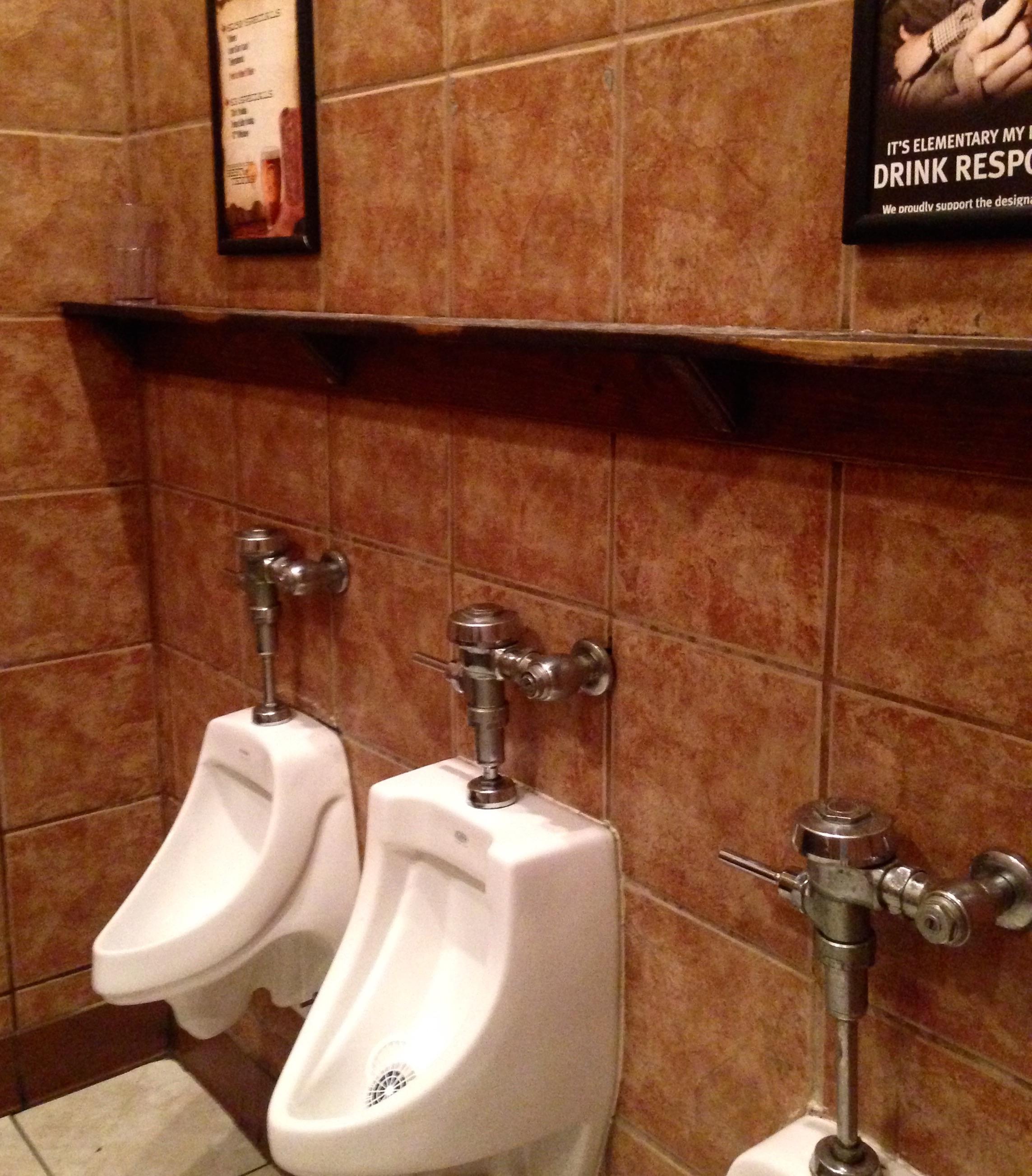 Hit my head on a shelf at a urinal. Realized many had fallen before me