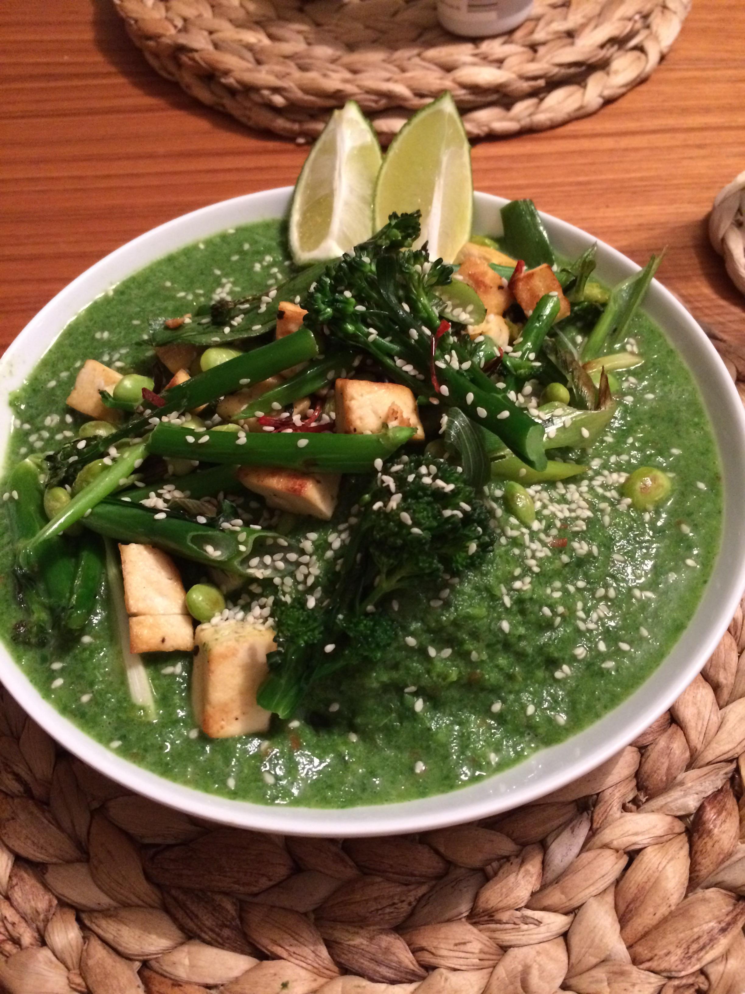 Green noodle soup with tofu. The rice noodles are underneath all the