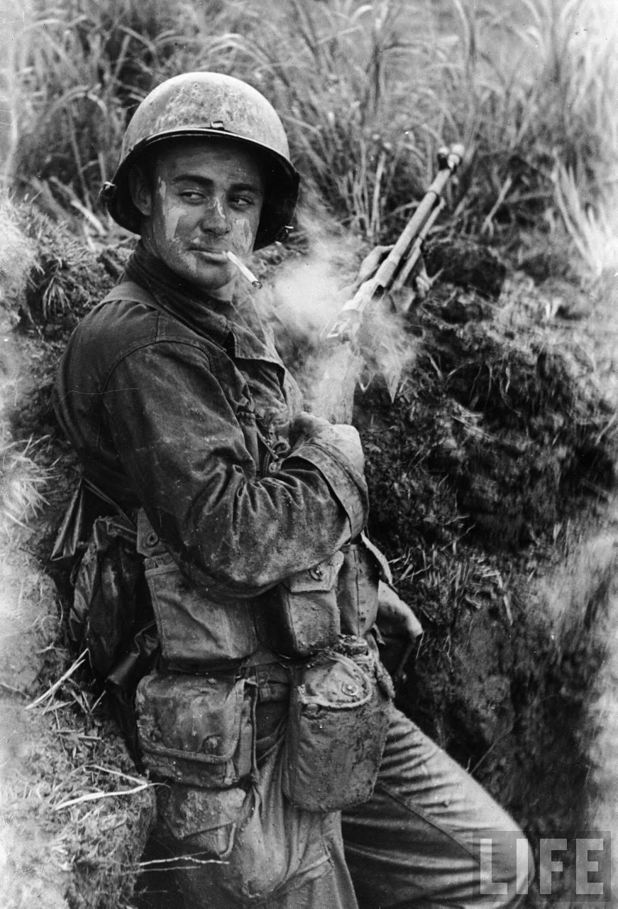 A BAR gunner from the 7th Infantry Division enjoying a lull in fighting