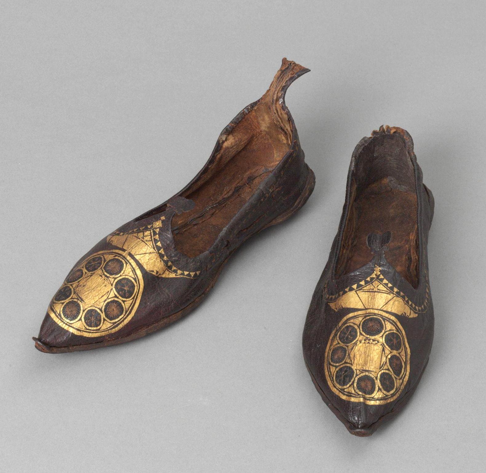 A Coptic woman's leather shoes with gilded symbols. Egypt, 300500 AD