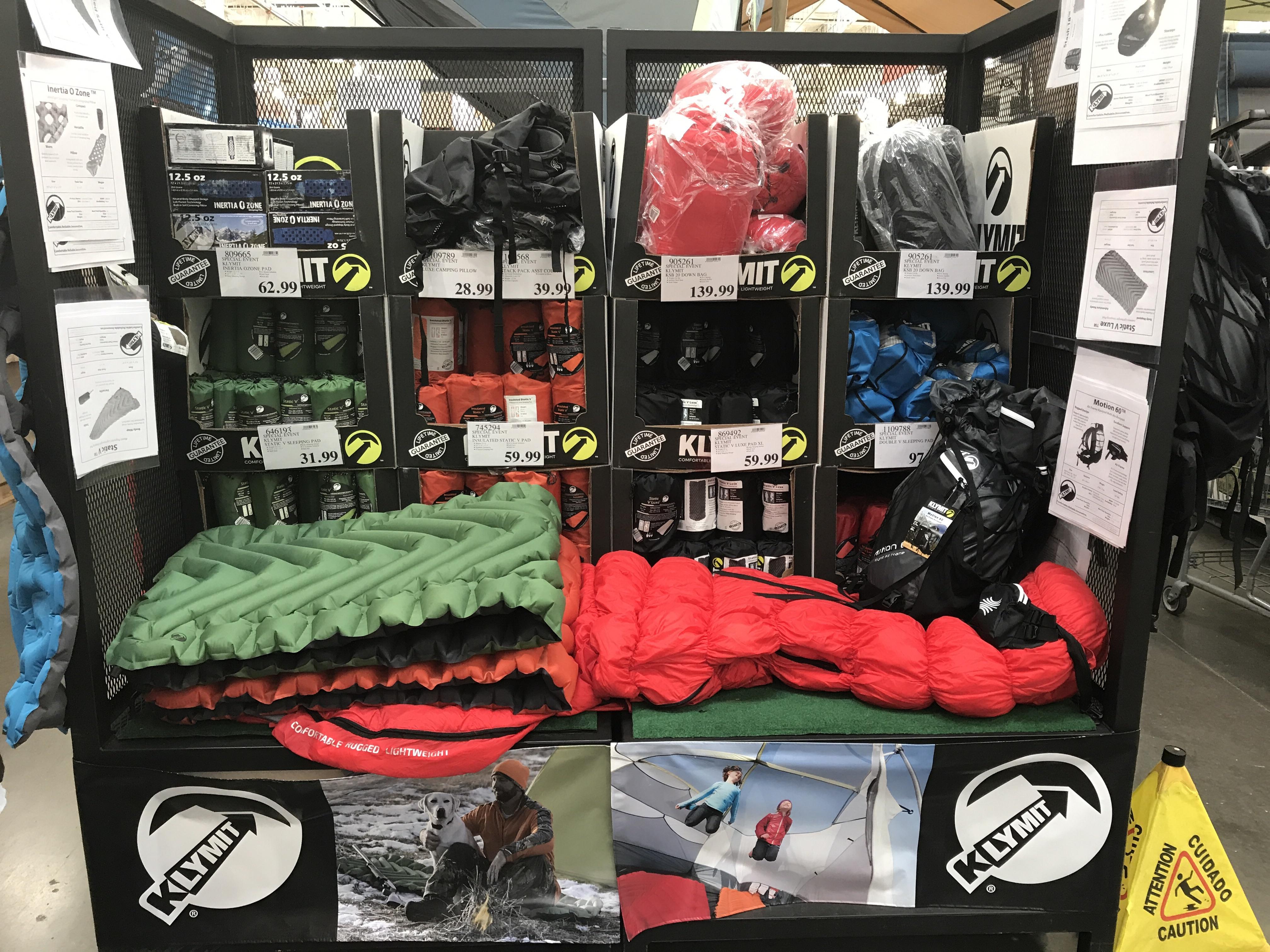 Klymit with a display at Costco. Pads, packs, down bags. Says "special