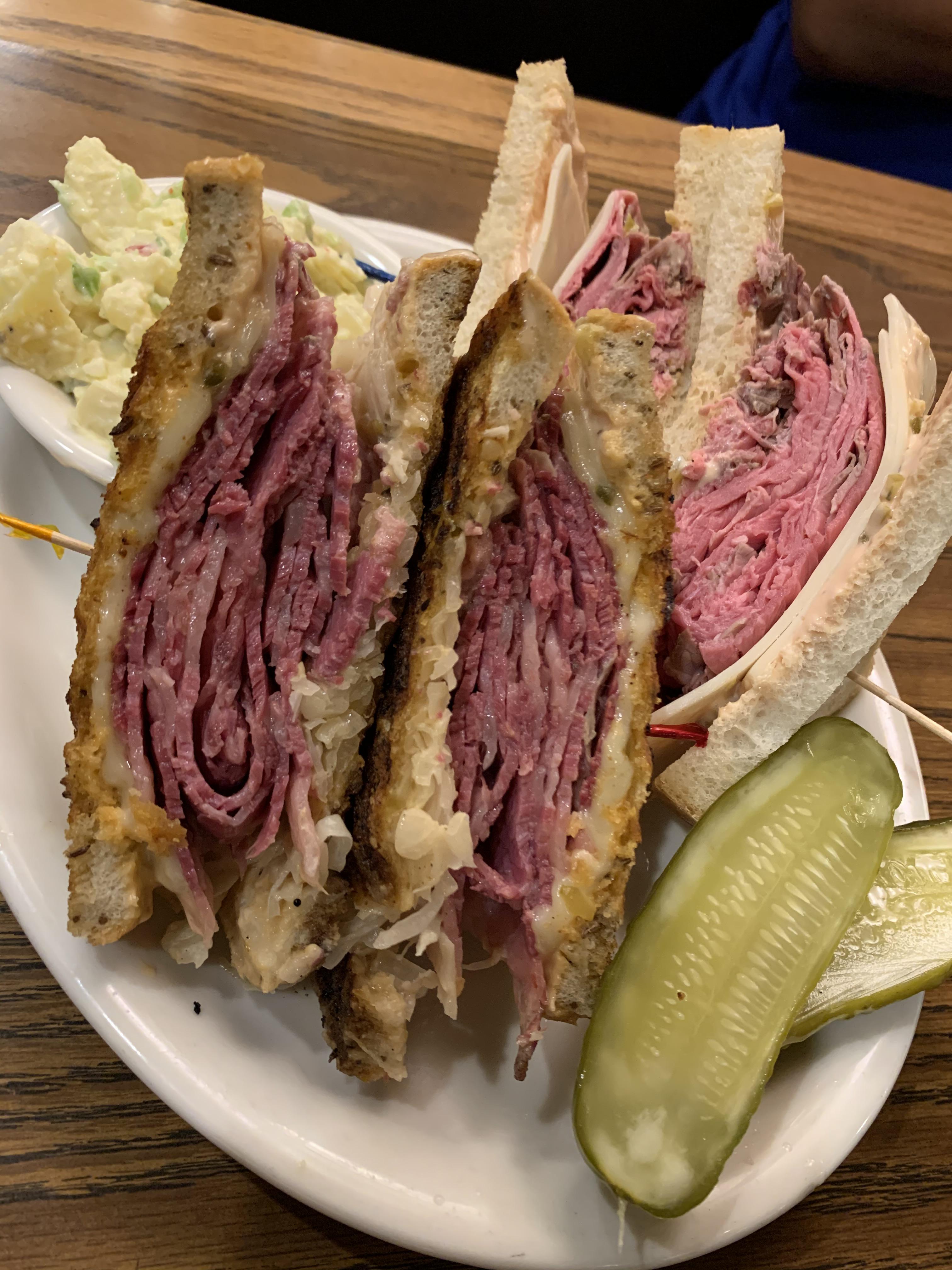 Grilled corned beef on rye, and roast beef with provolone on country