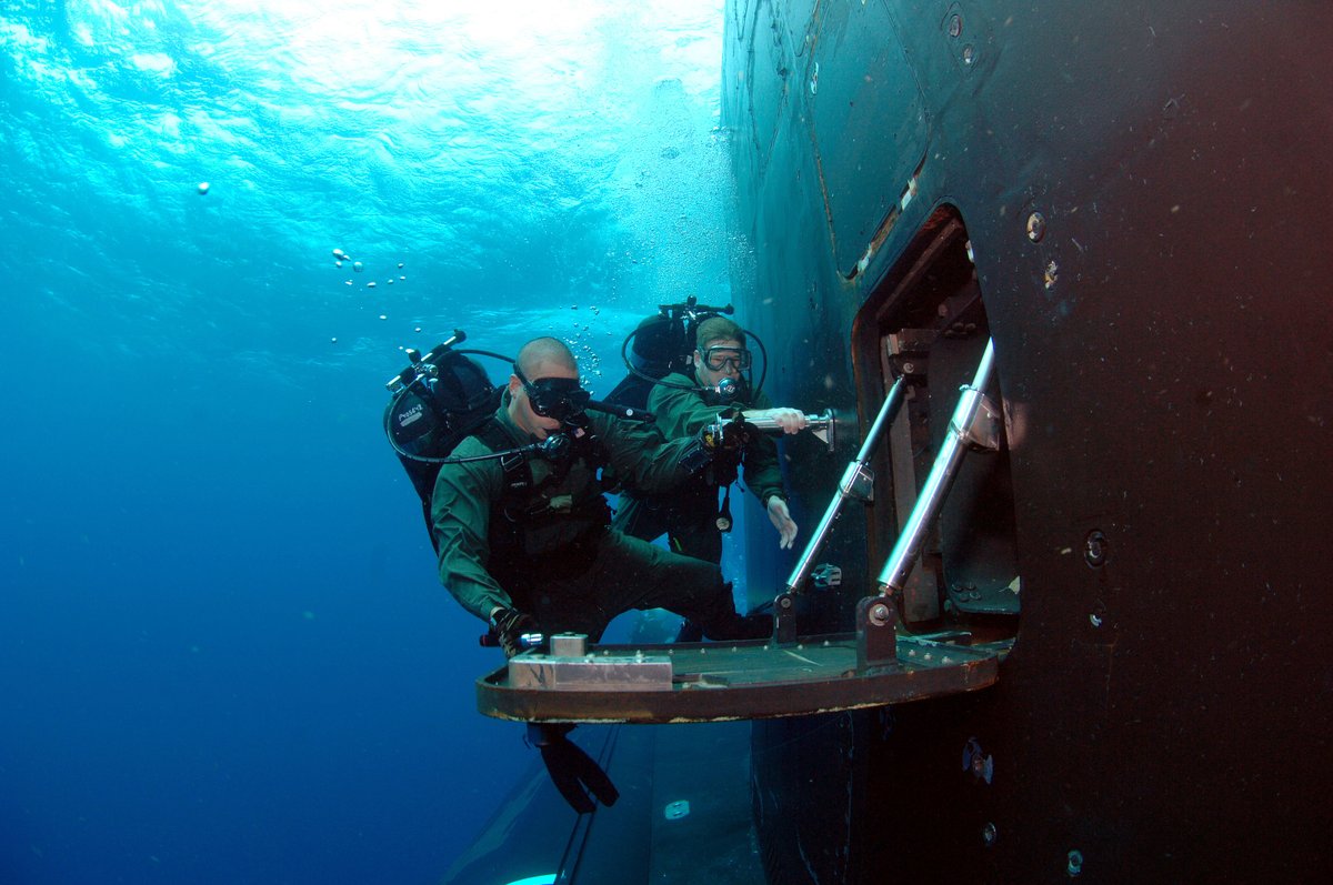 Grabbing some gear from the sail of a fast attack submarine r/scuba