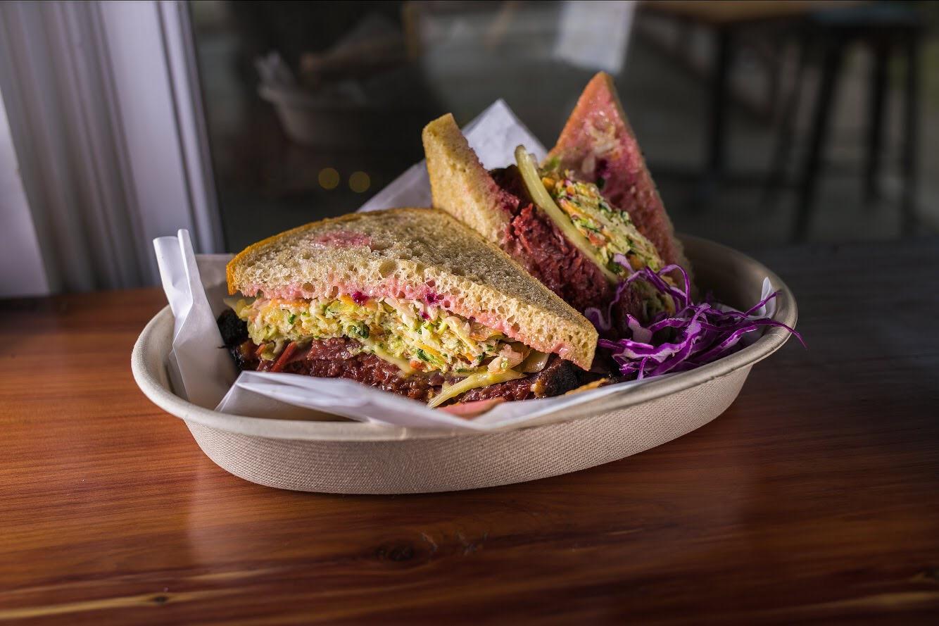 Pastrami sandwich, seasonal slaw, emmental cheese, beet ketchup/mayo