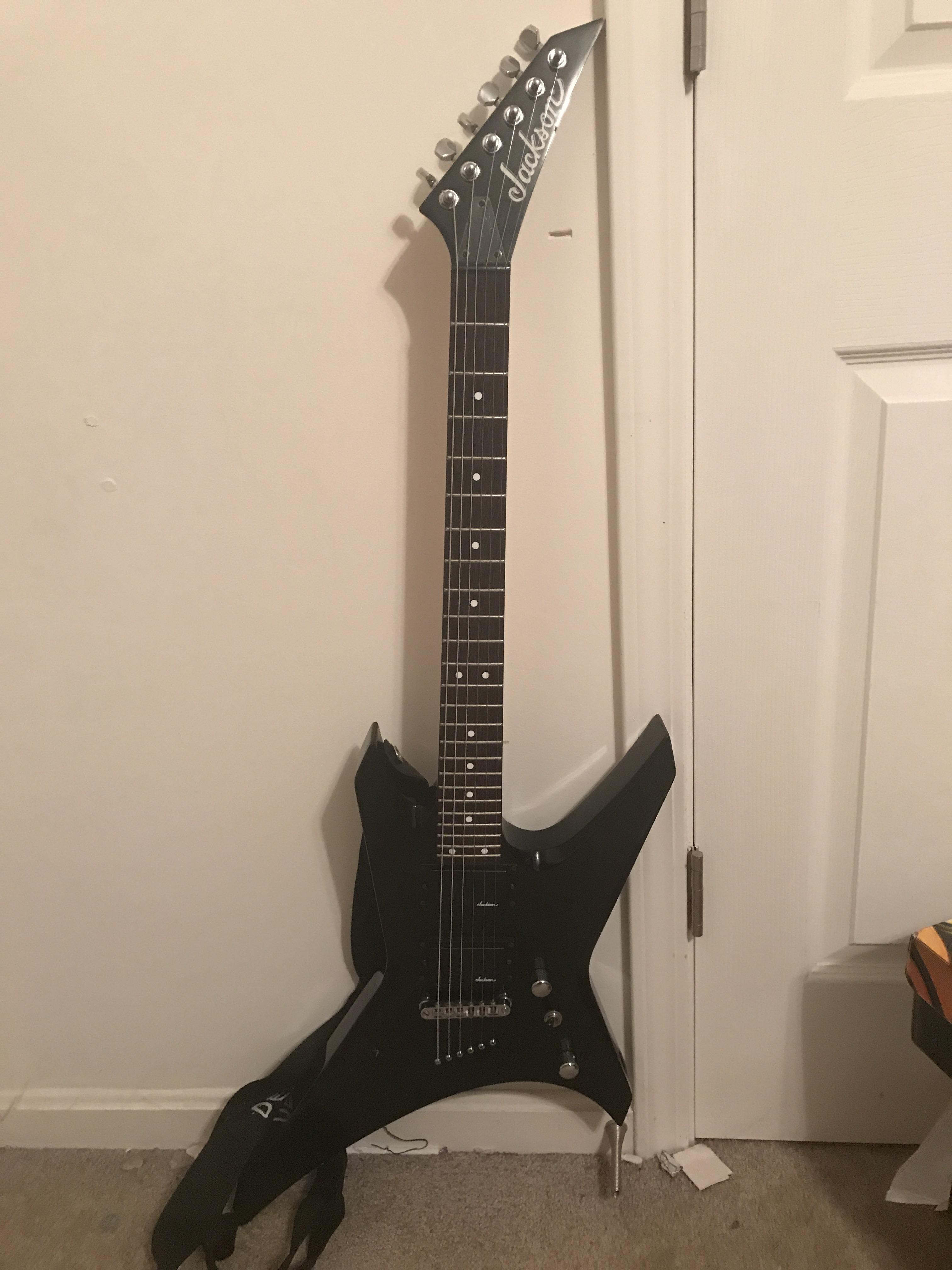 Anybody know what kind of a guitar this is and or how much it’s worth