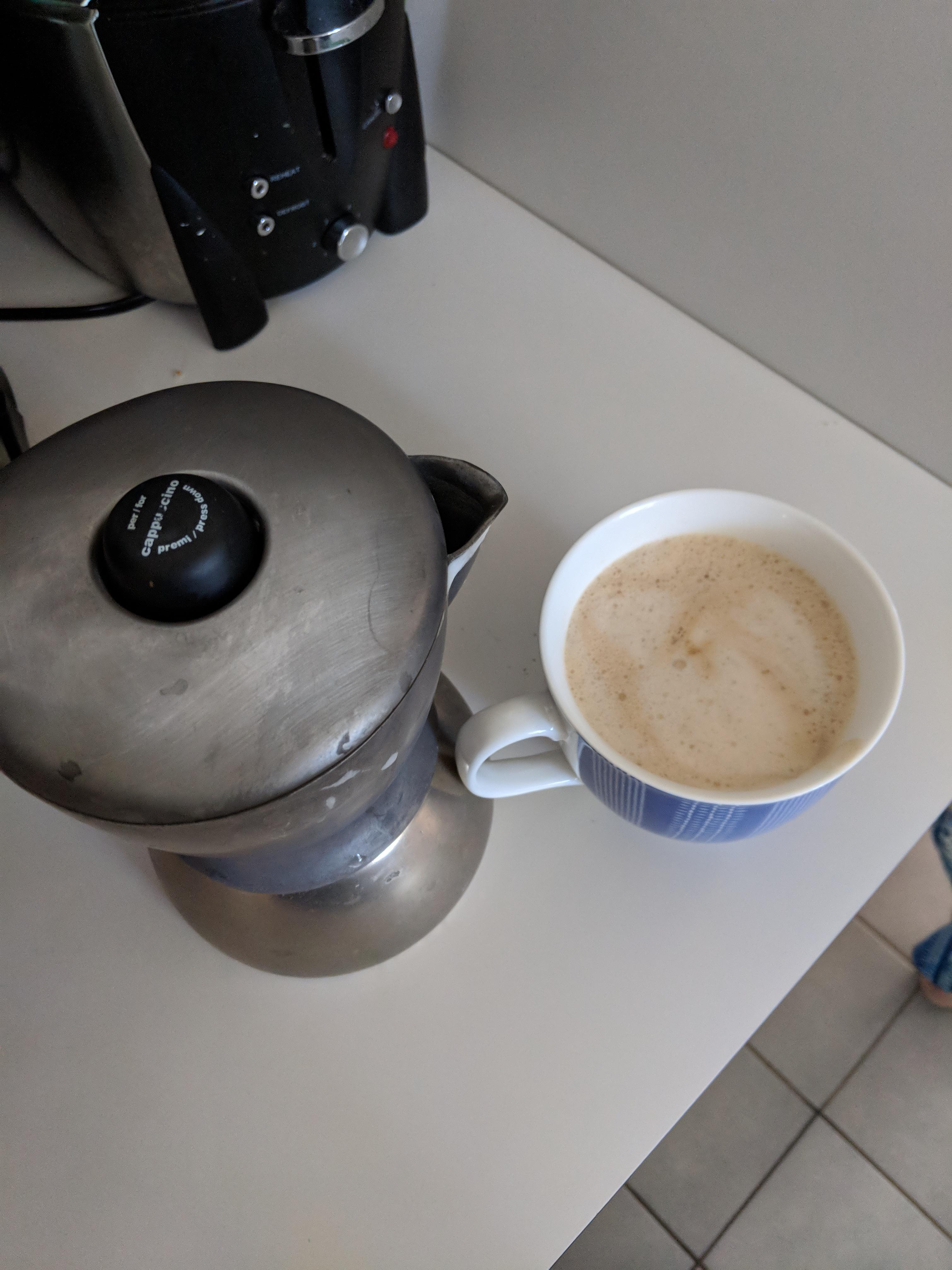 This stovetop coffee maker takes in milk, water and coffee grounds and