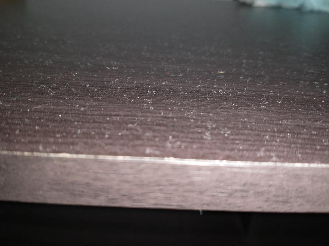 The layer of dust on my bedroom TV stand after only a few days after