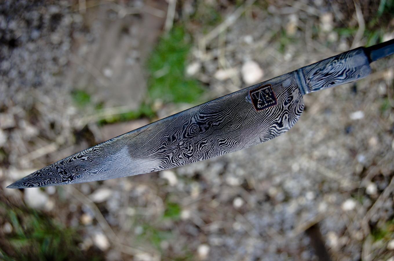 Moderate layer count (240ish?) twist belt knife I've got etching at