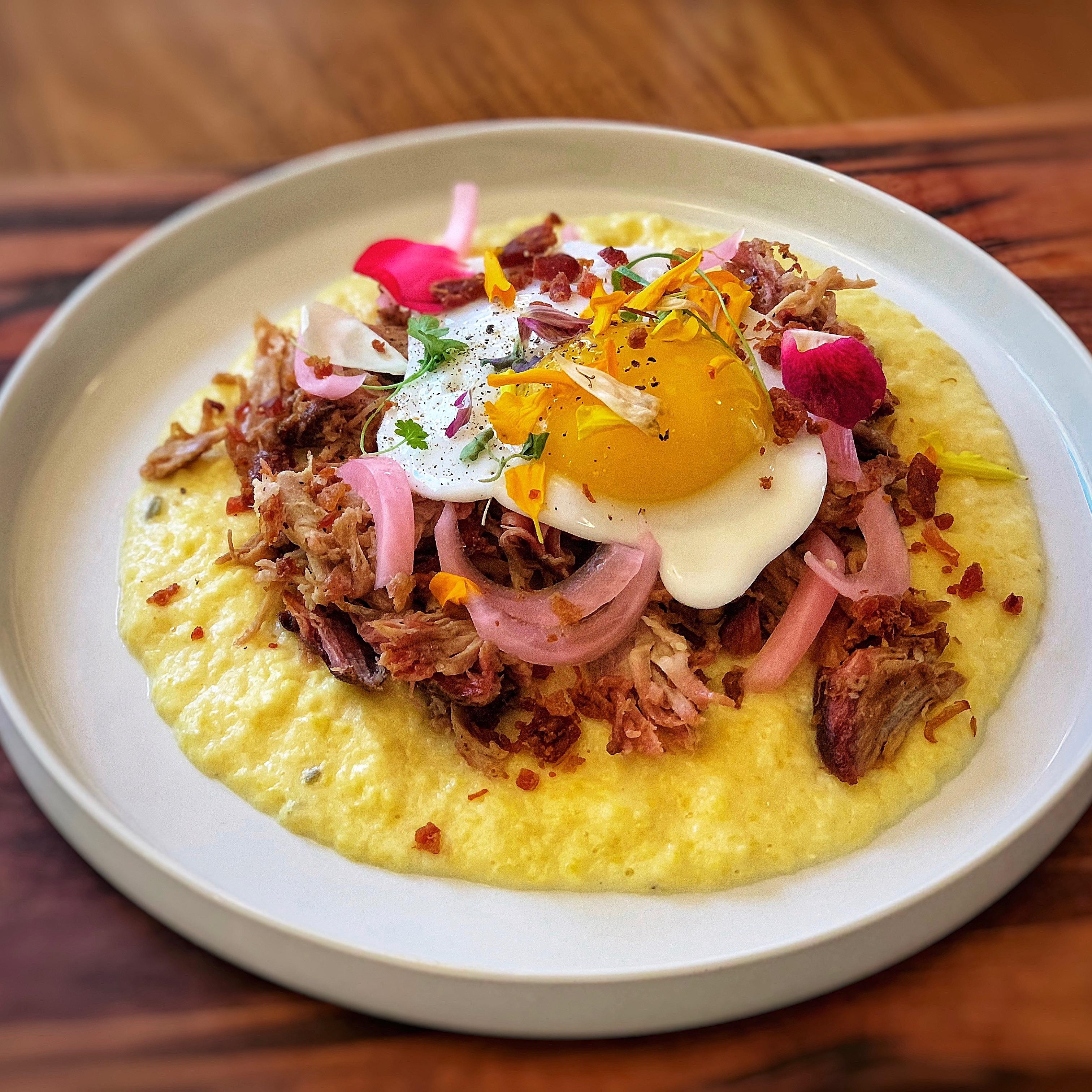Smoked Pork Shoulder, Jalapeño Cheddar Grits, Pickled Onion, Bacon