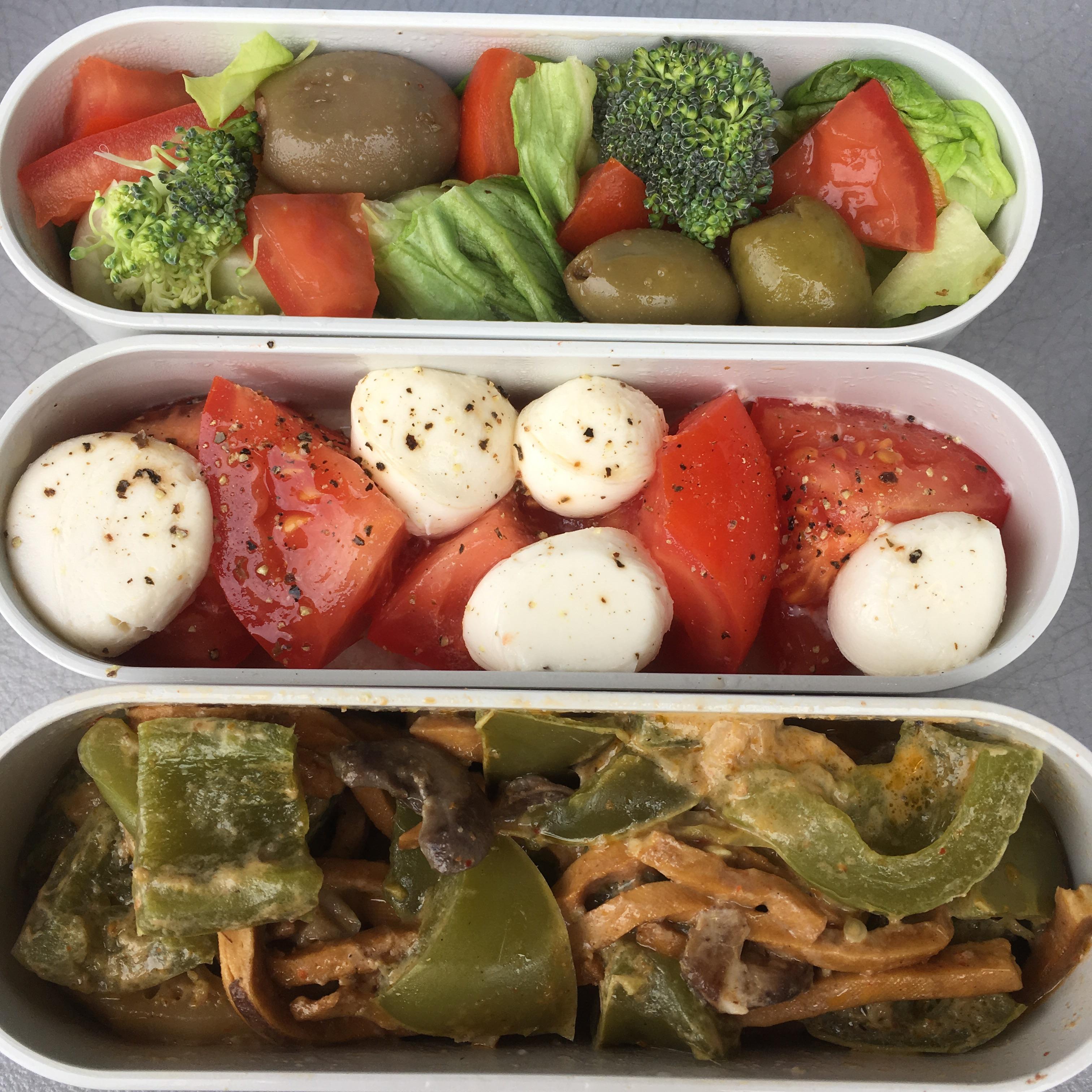 Coconut curry tofu noodles, mozzarella balls and tomatoes, and salad