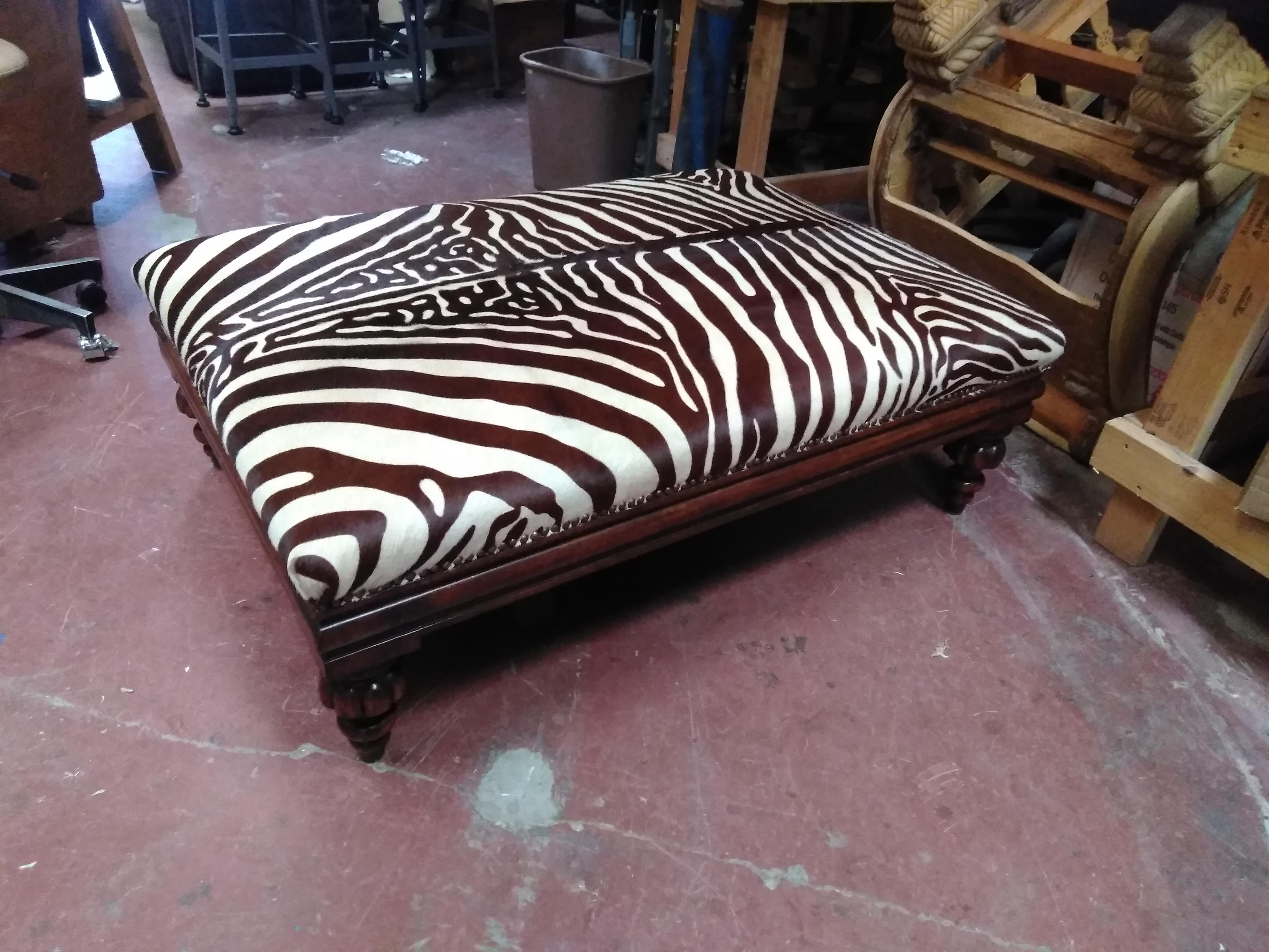 Zebra painted cowhide ottoman r/upholstery