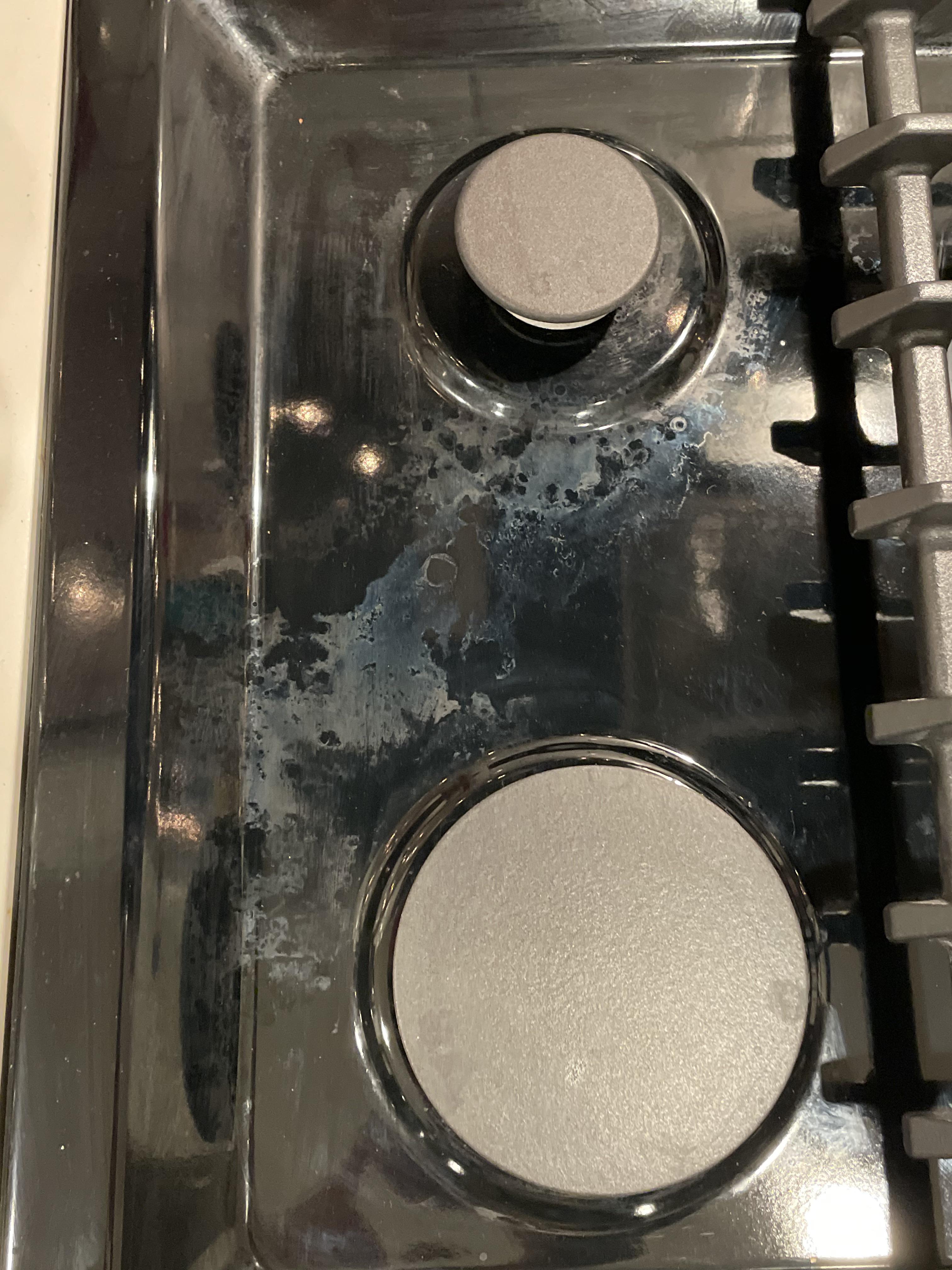 How to prevent and remove cloudy discoloration on black gas stovetop