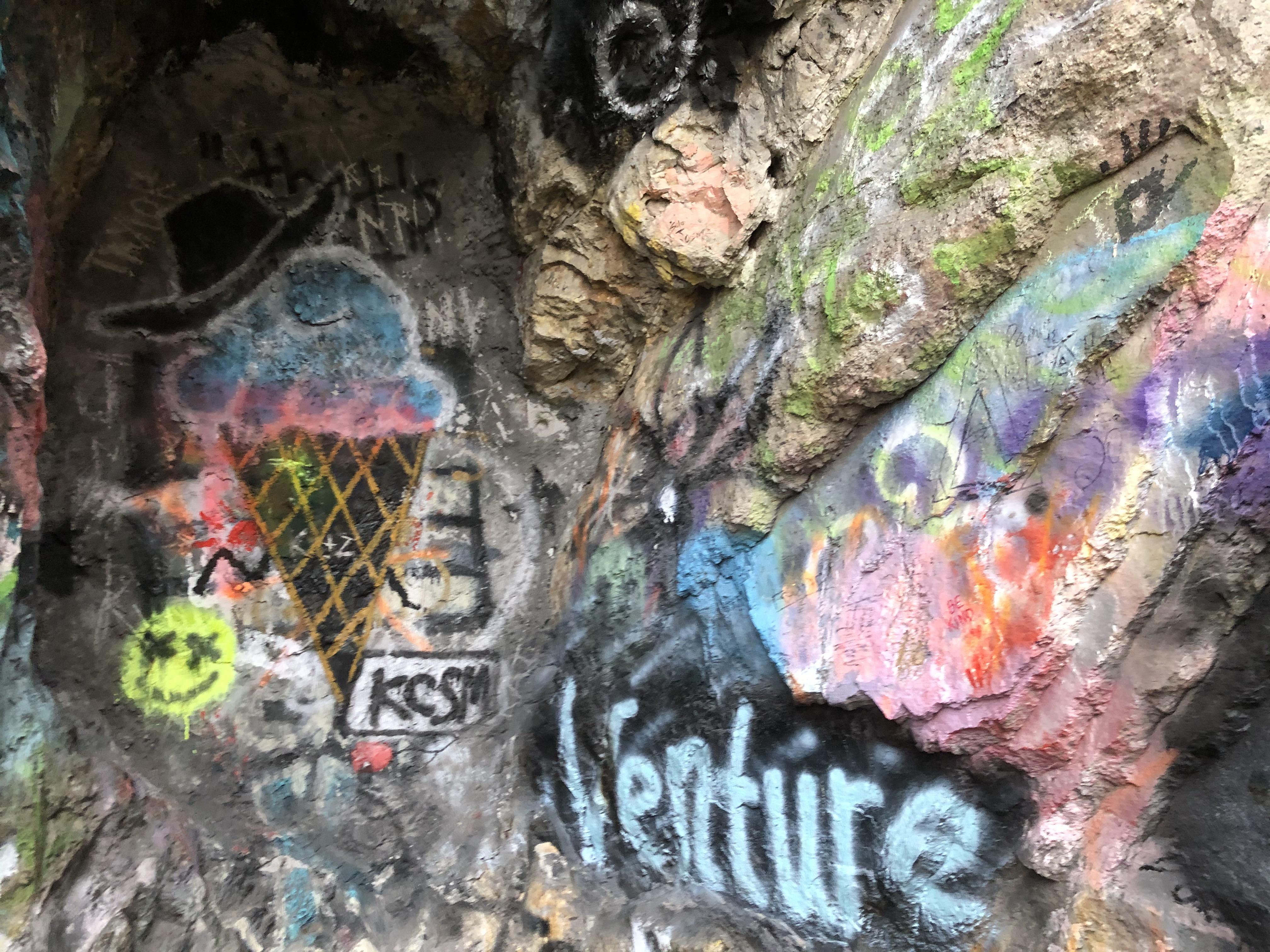 This graffiti on the side of a mountain in a small cave in Rock Canyon
