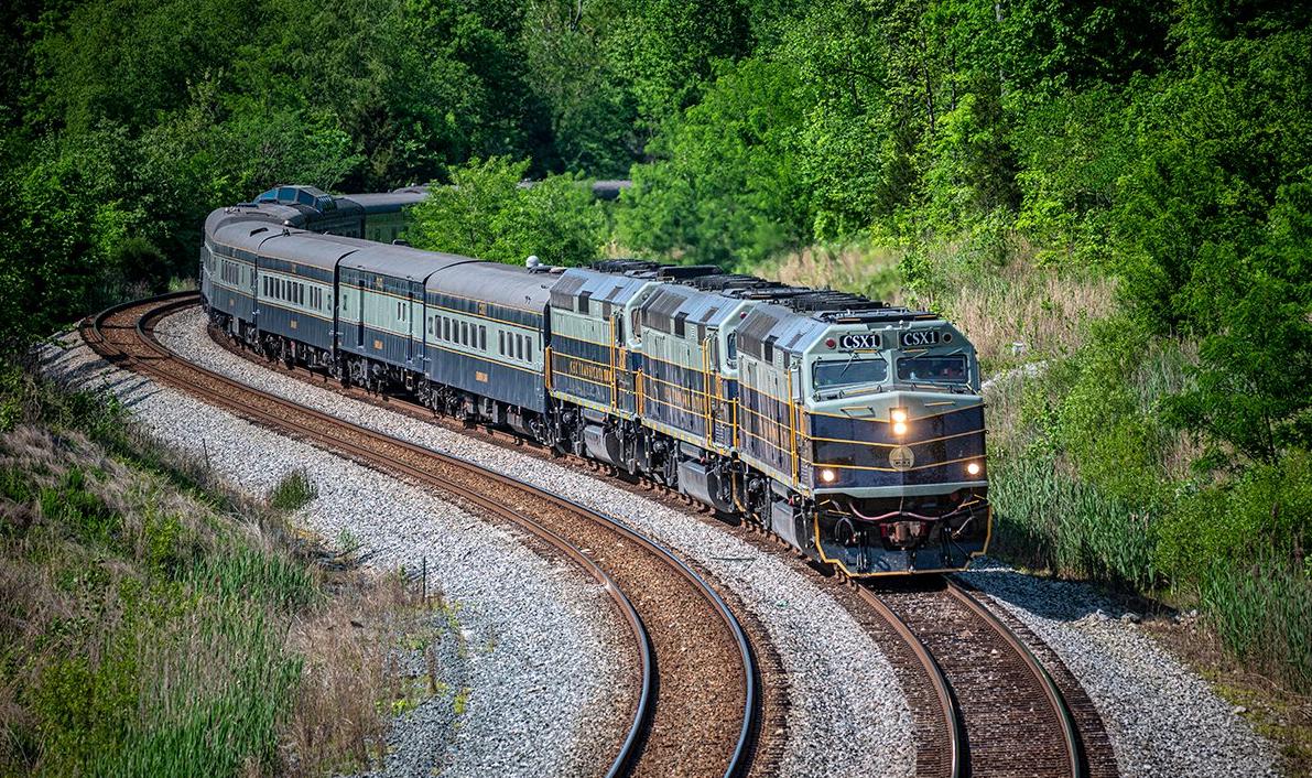 CSX P00109 Presidential Office Car passenger train heads through the S