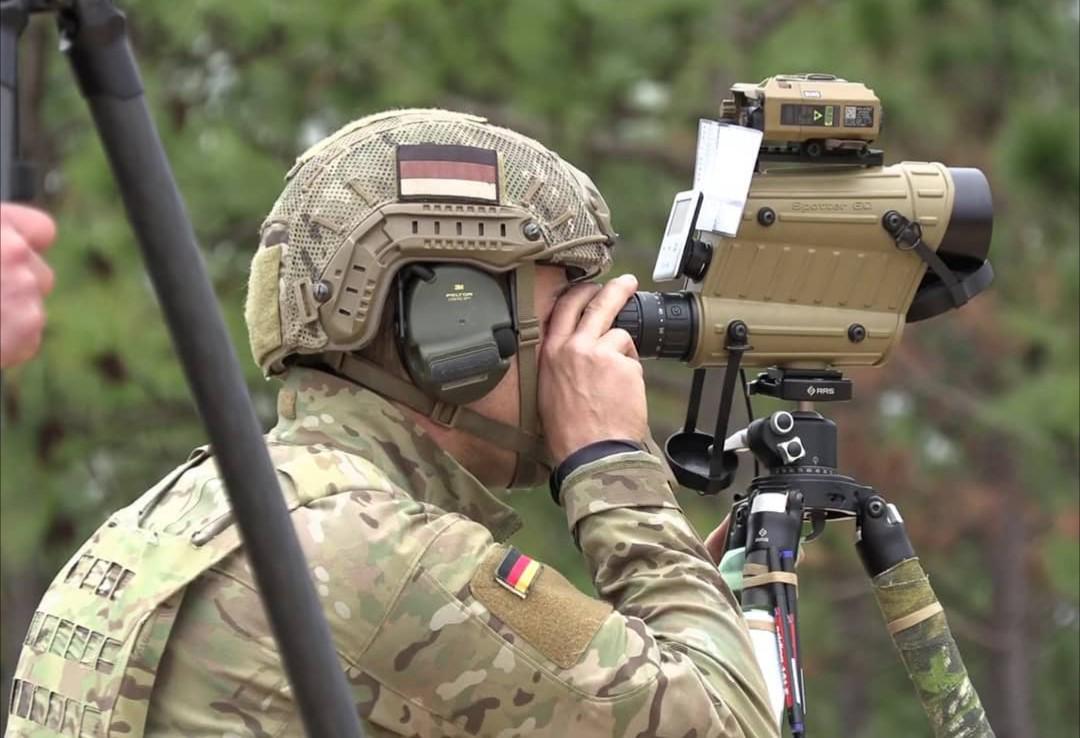 German special forces sniper of the KSK looking through a kittedout