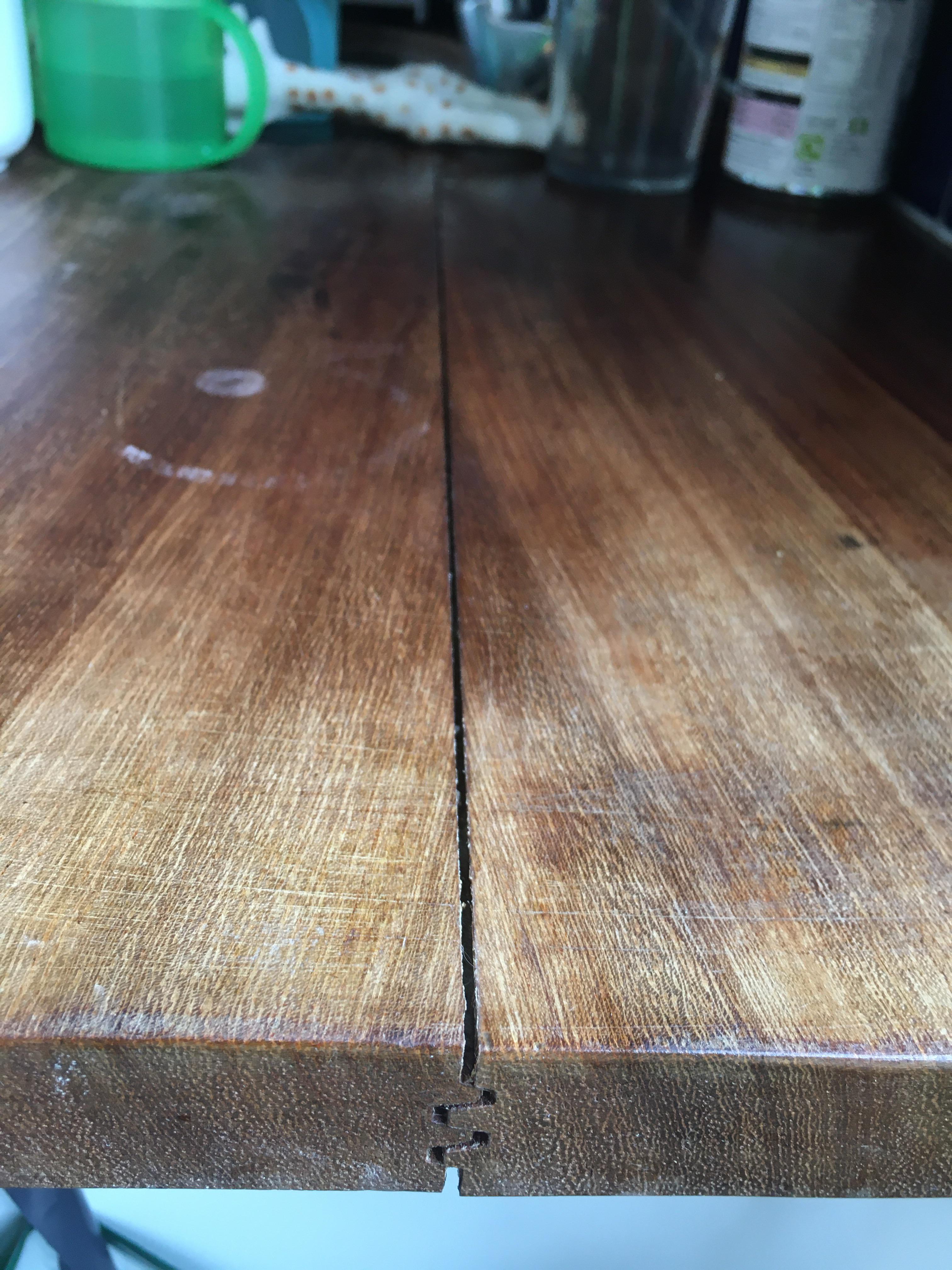 Wooden countertop separating due to heat of fitted dishwasher below