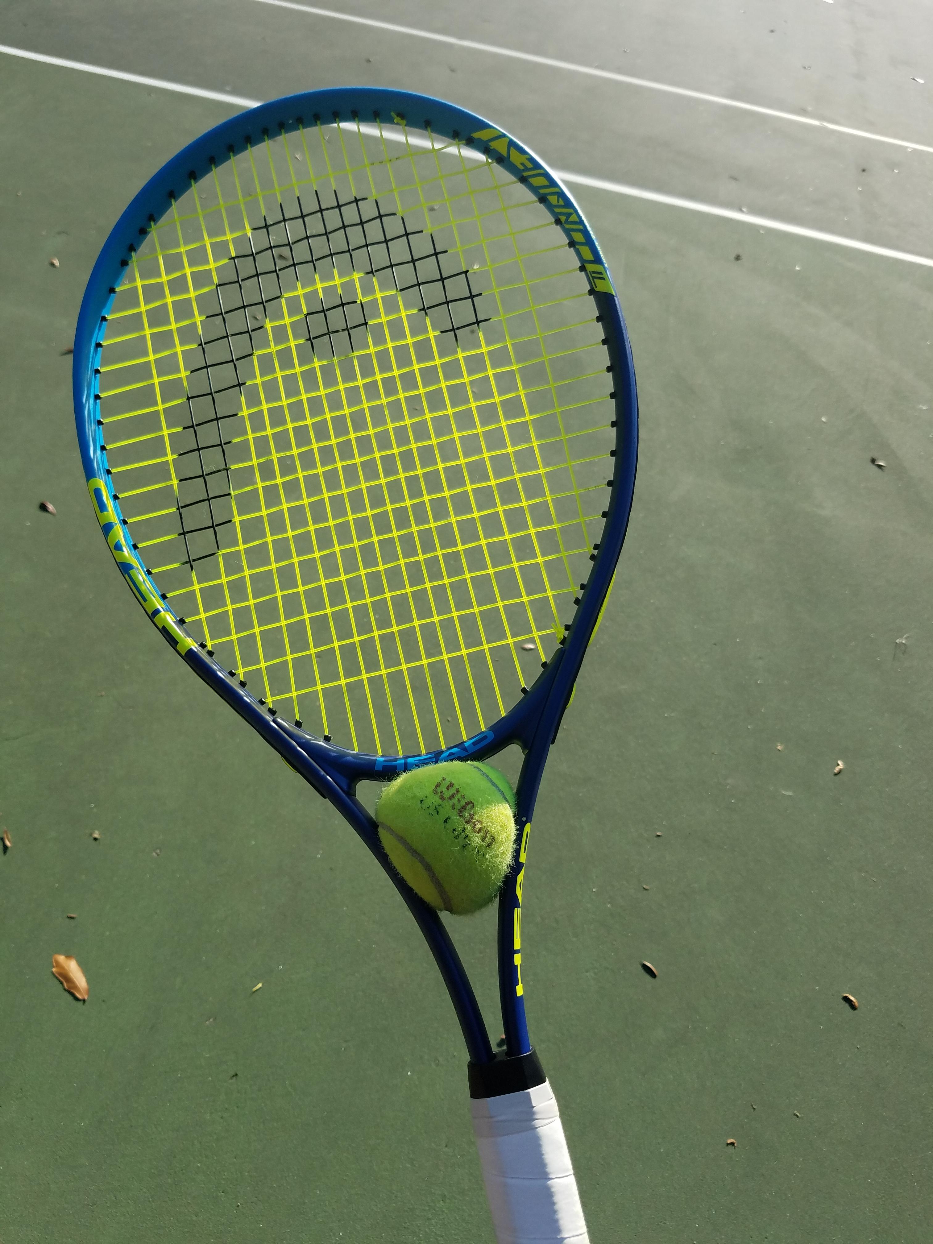 My ball got stuck in my racket while playing tennis. r/mildlyinteresting