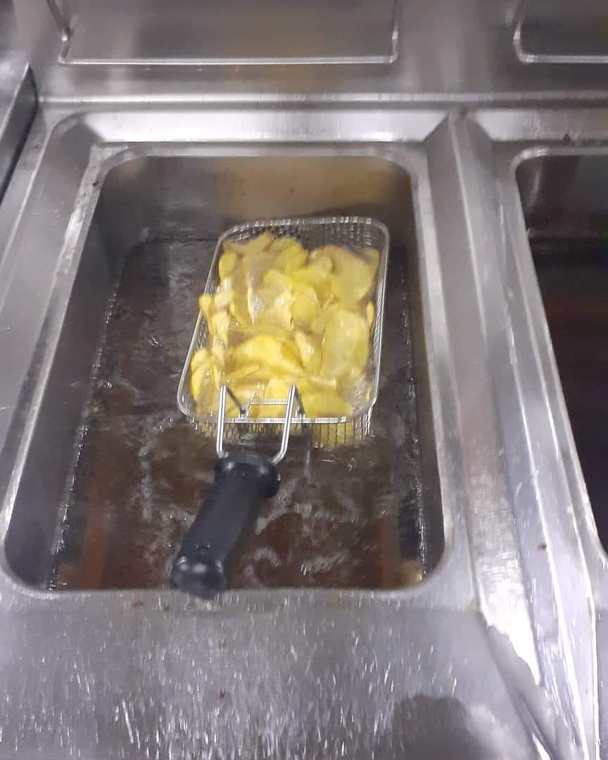 Night shift, kitchen cleaned already, fryer baskets in the fattank