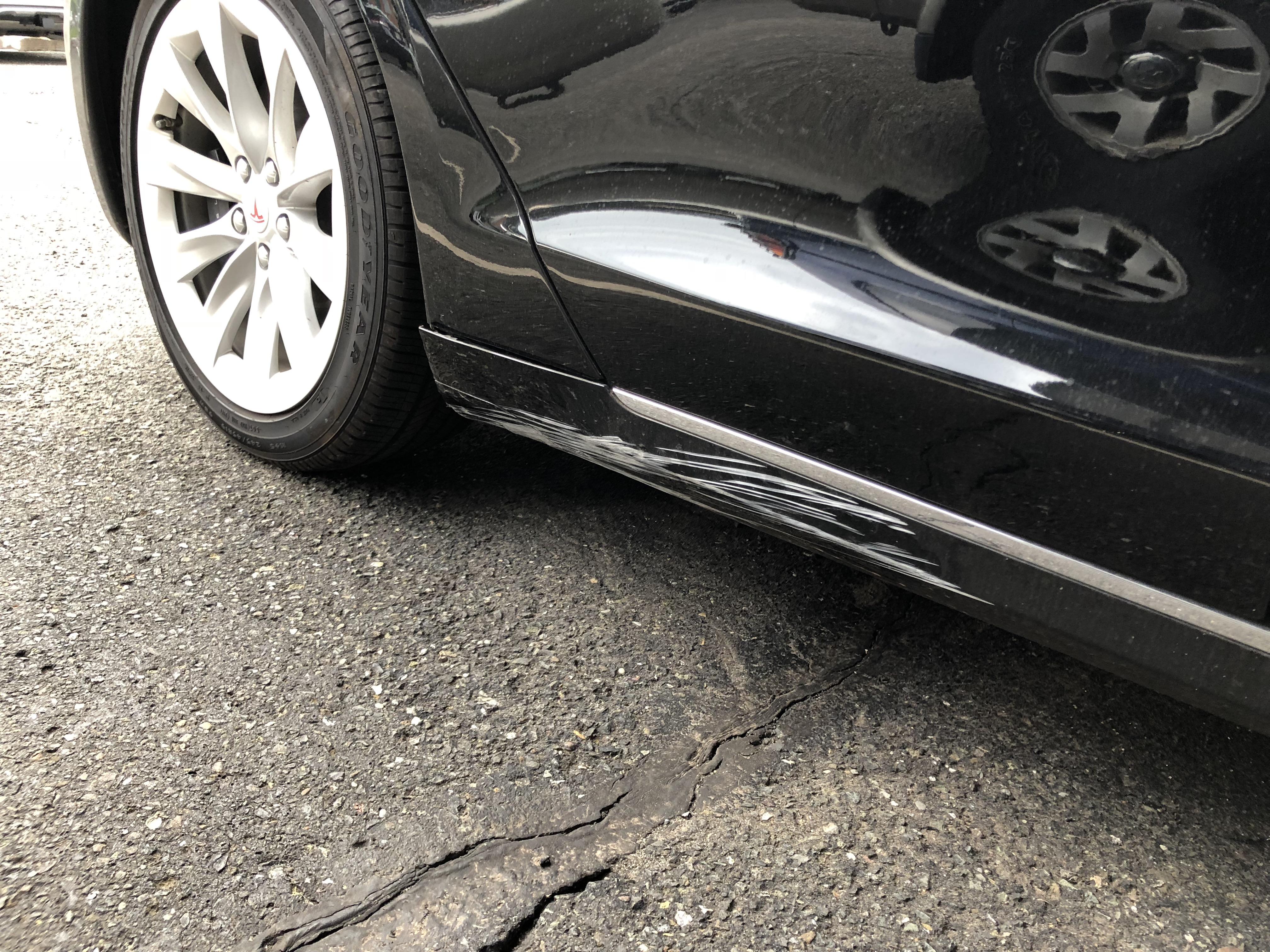 Got scratched at a curb from a tight turn, DIY possible with Tesla OEM