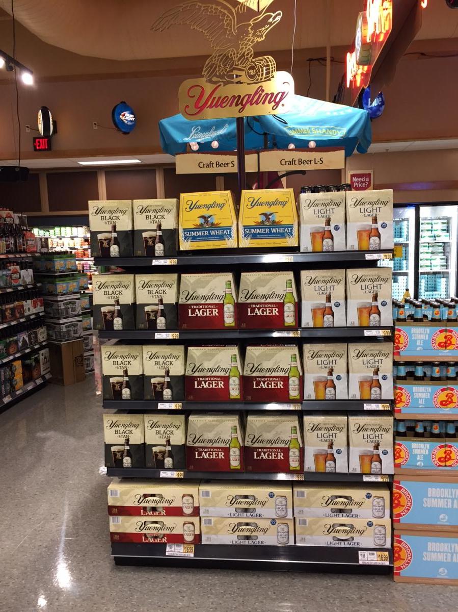 They should organize beer shelves by the label color not who makes it