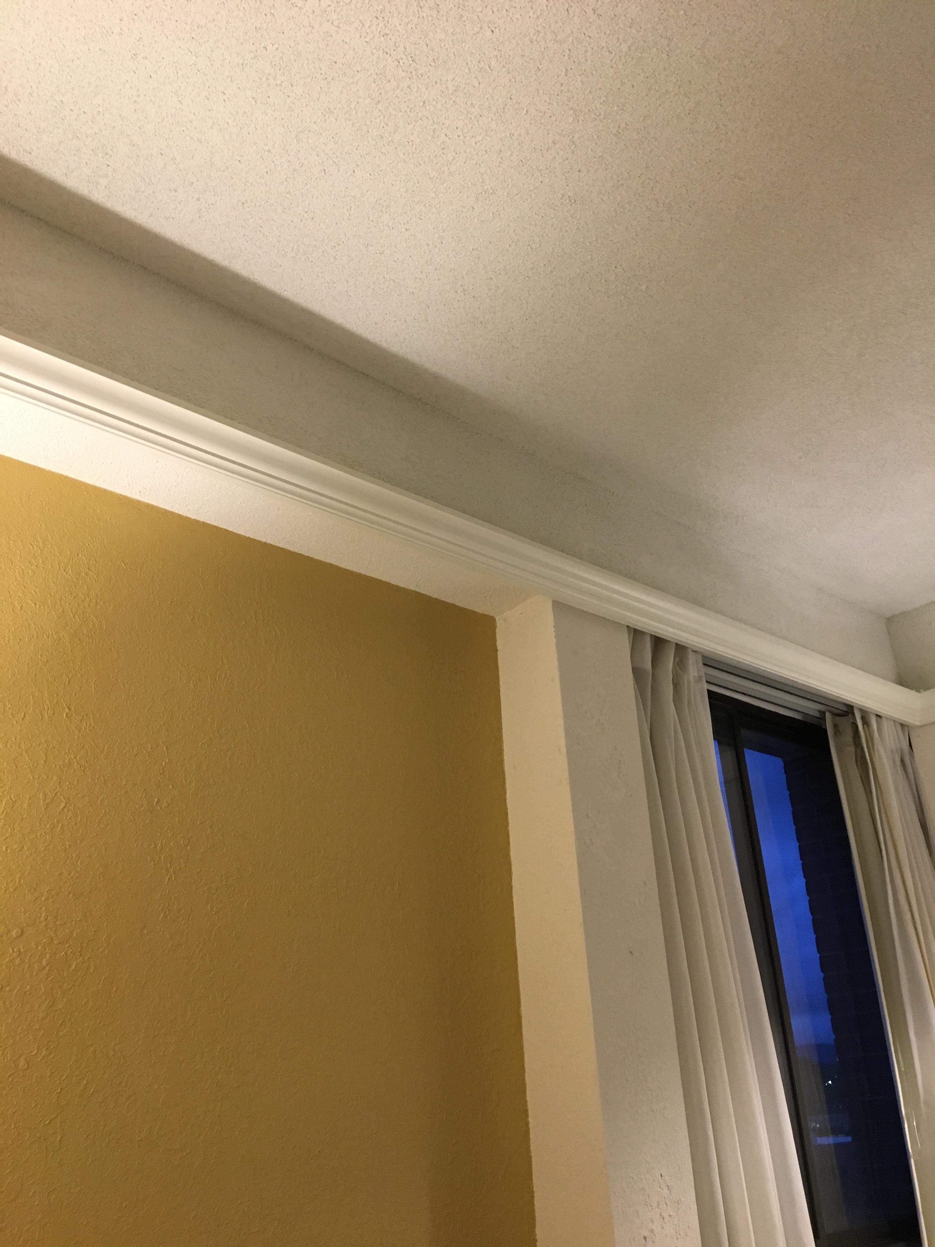 My hotel rooms’ crown molding is far below the actual ceiling r