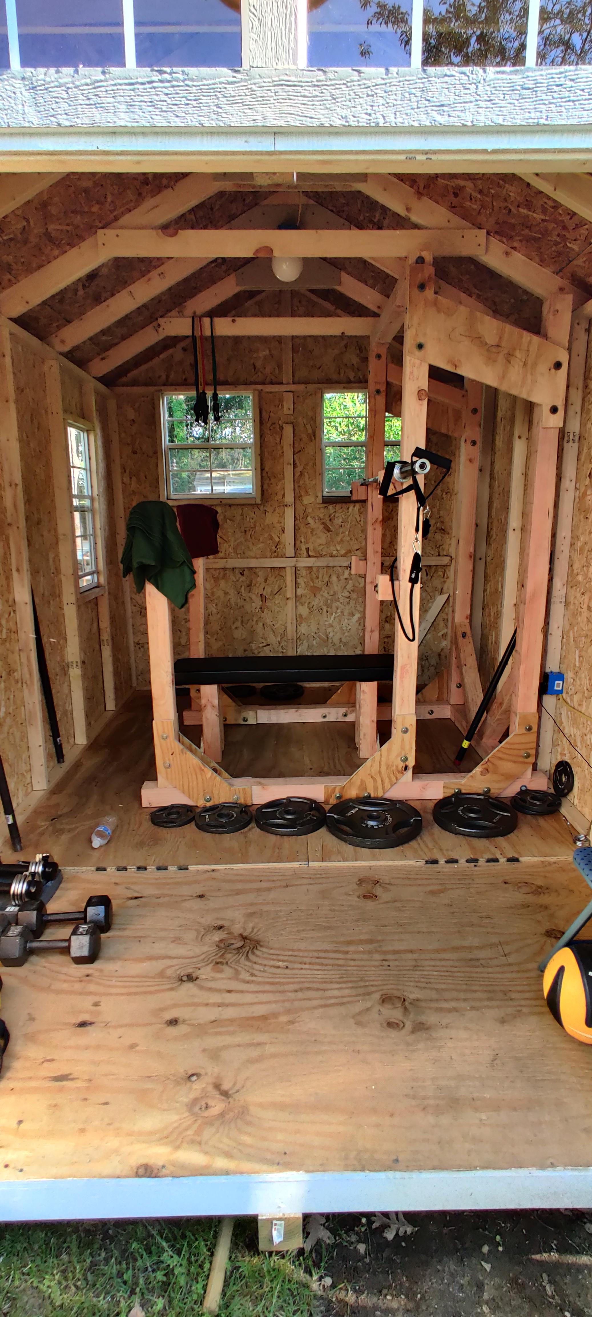 Built a shed, rack and bench for the home gym. It's a work in progress