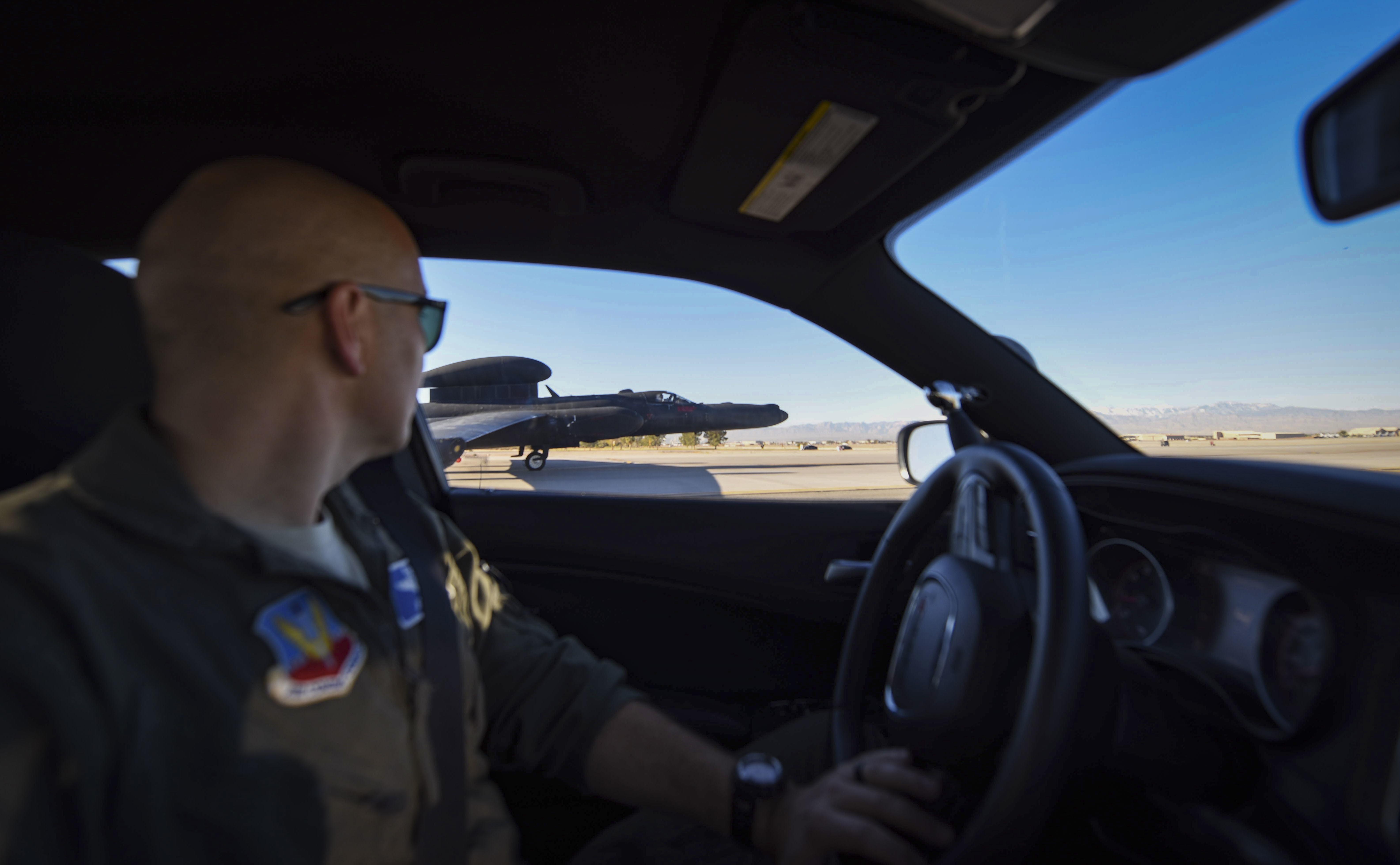 U2 pilot assists a U2 landing while driving a chase car at Nellis Air