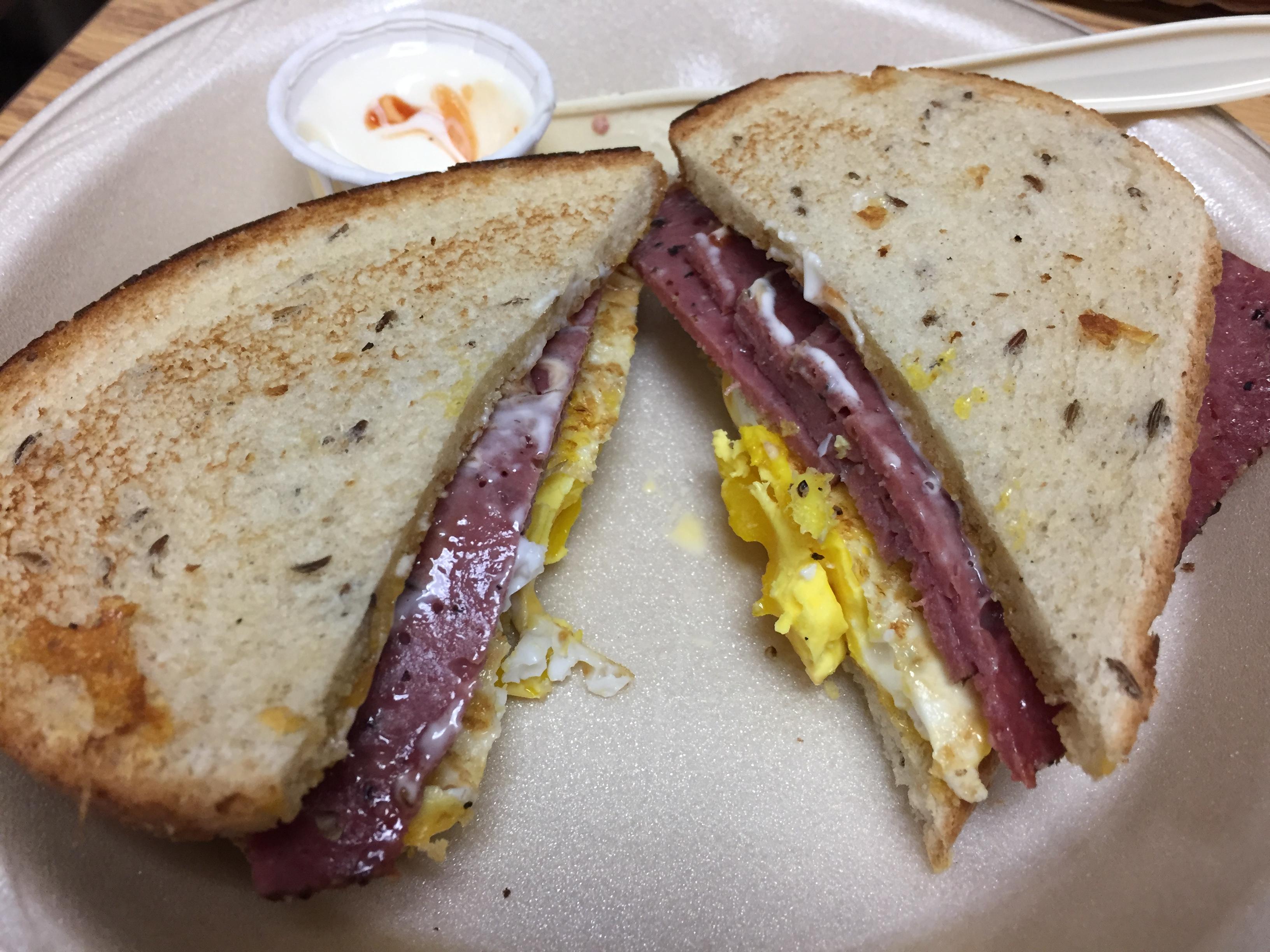 Over Medium Egg, American Cheese, Venison Pastrami on Seeded Rye Toast