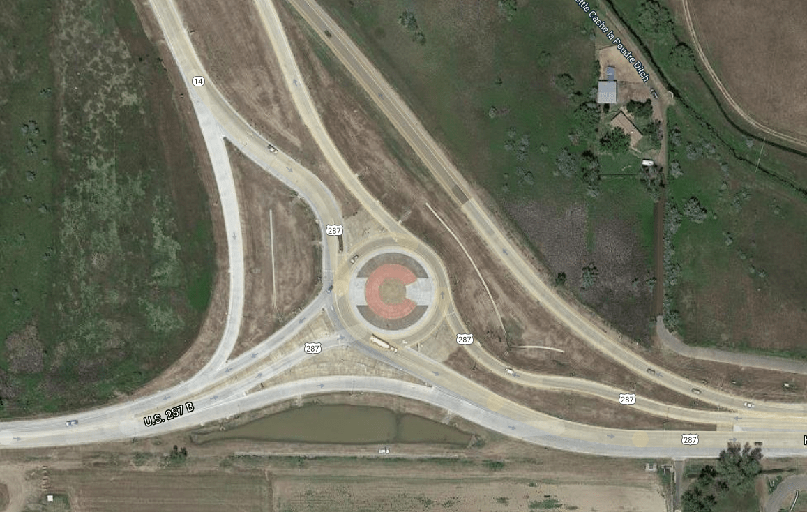 Satellite view of a Colorado flag in the roundabout north of Fort