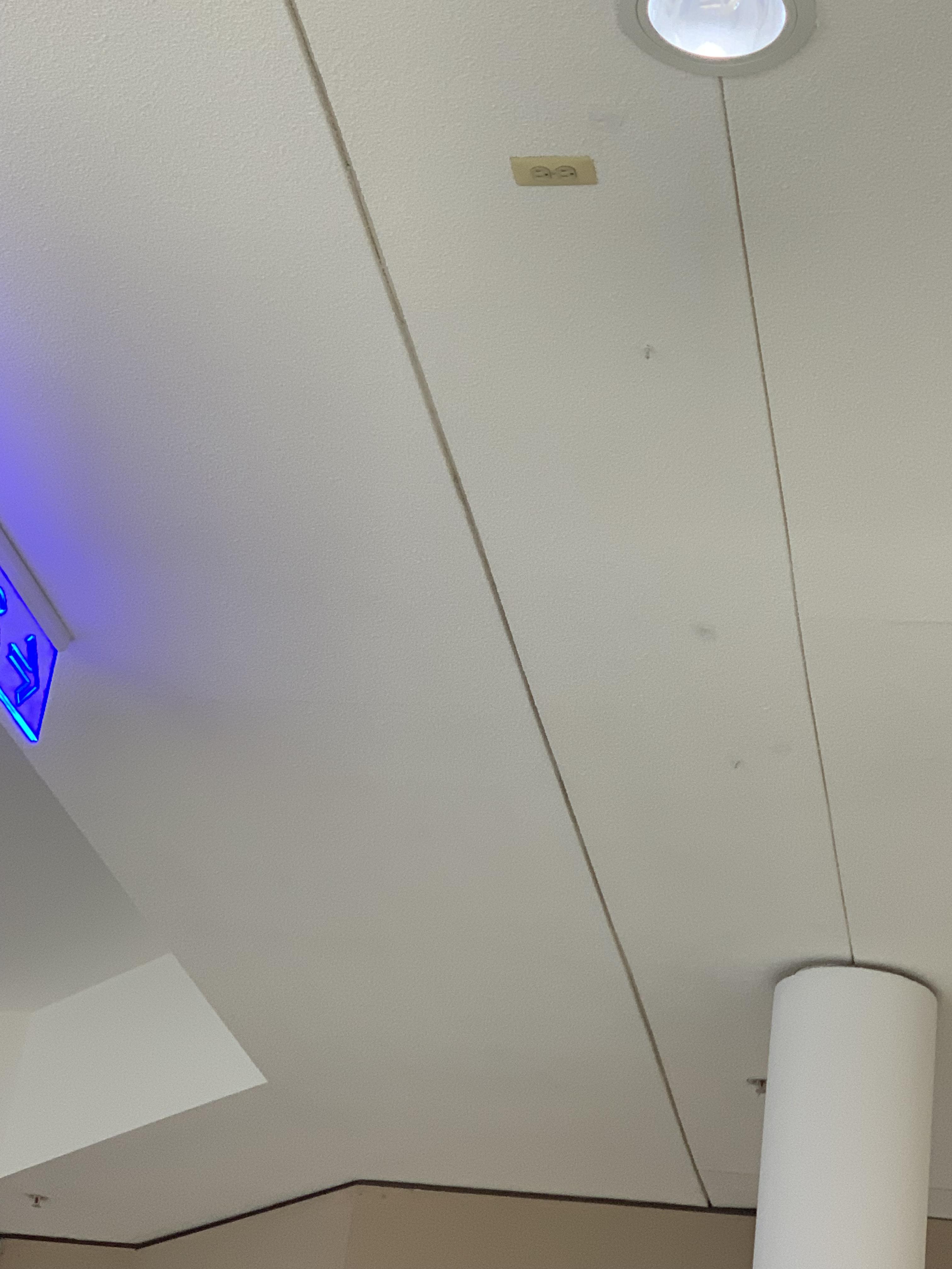 At the mall there’s a power outlet on the ceiling : r/mildlyinteresting