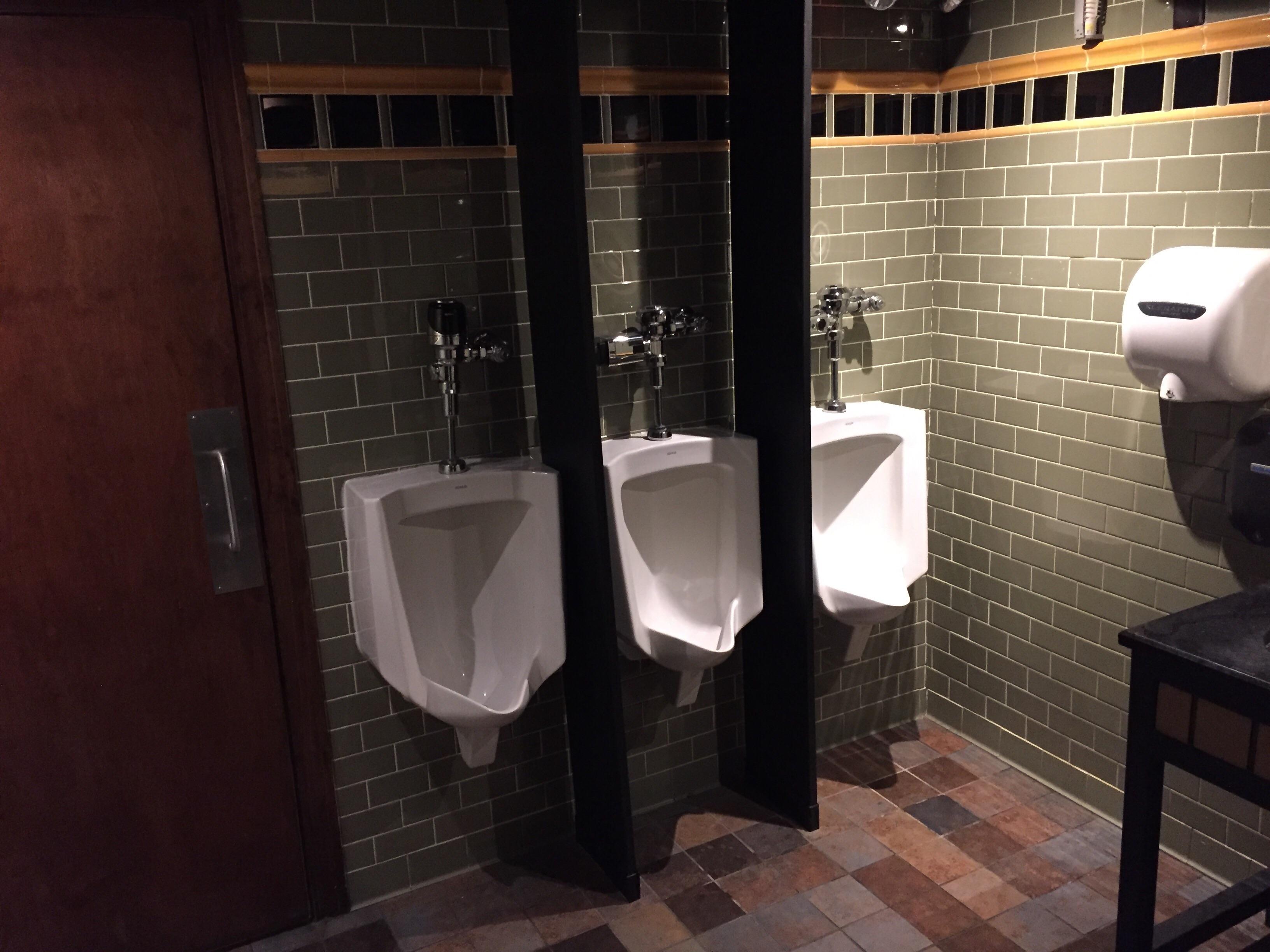 The urinals in one of the bathrooms at my job. No winners. CrappyDesign