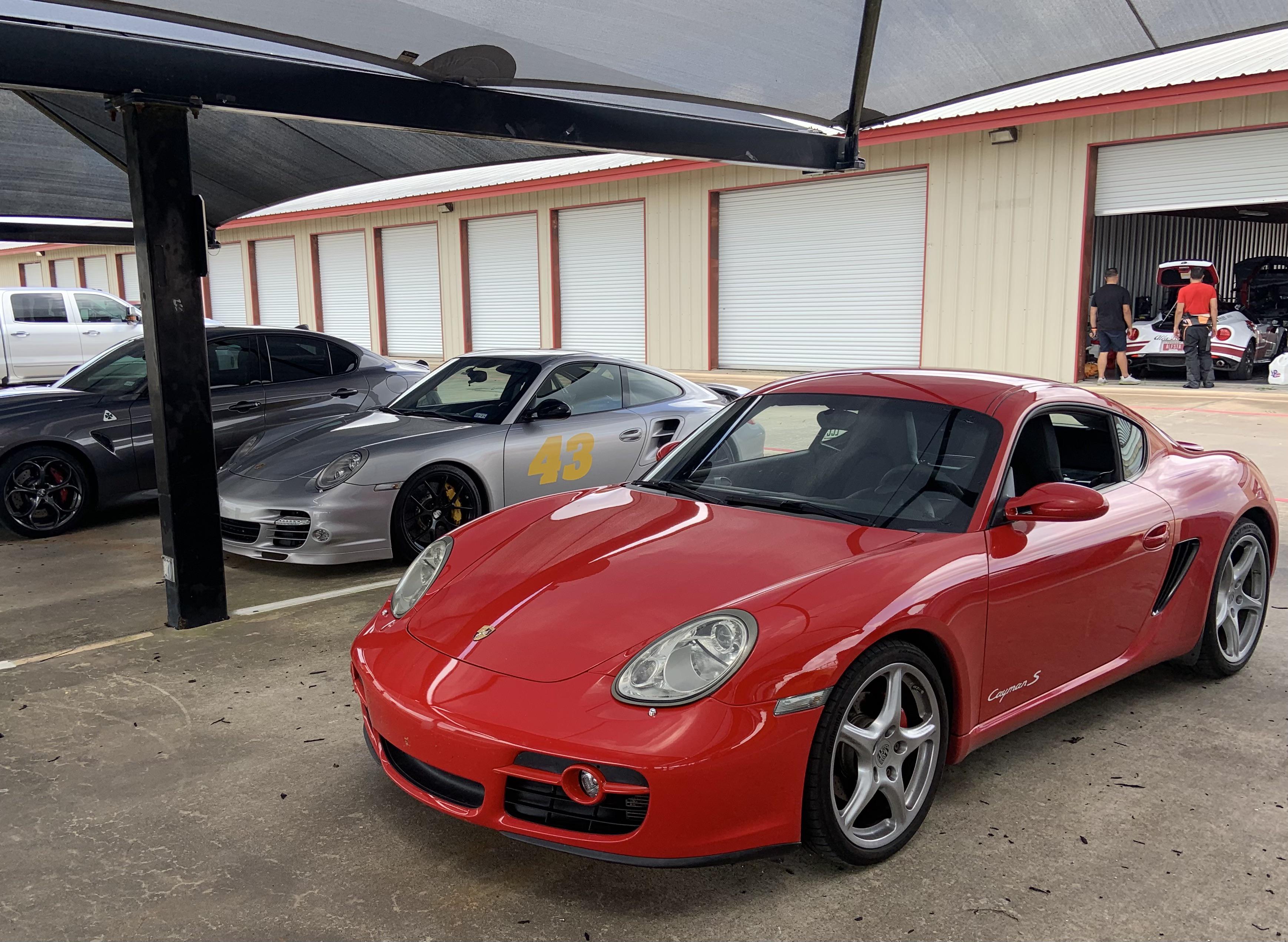 My Cayman making some new friends at the track ) r/Porsche