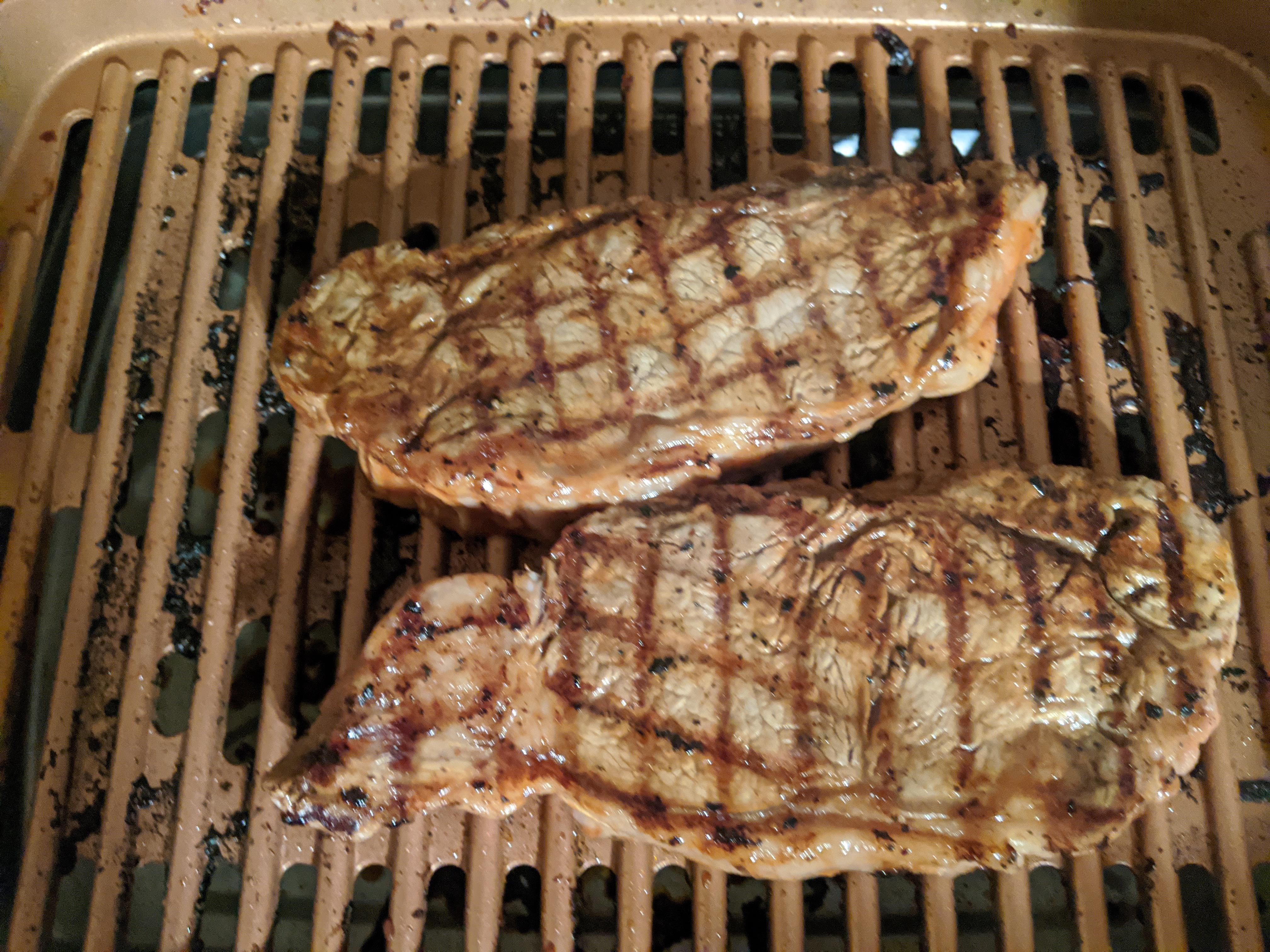 Steak on an indoor grill with baked potato and broccoli. r/tonightsdinner