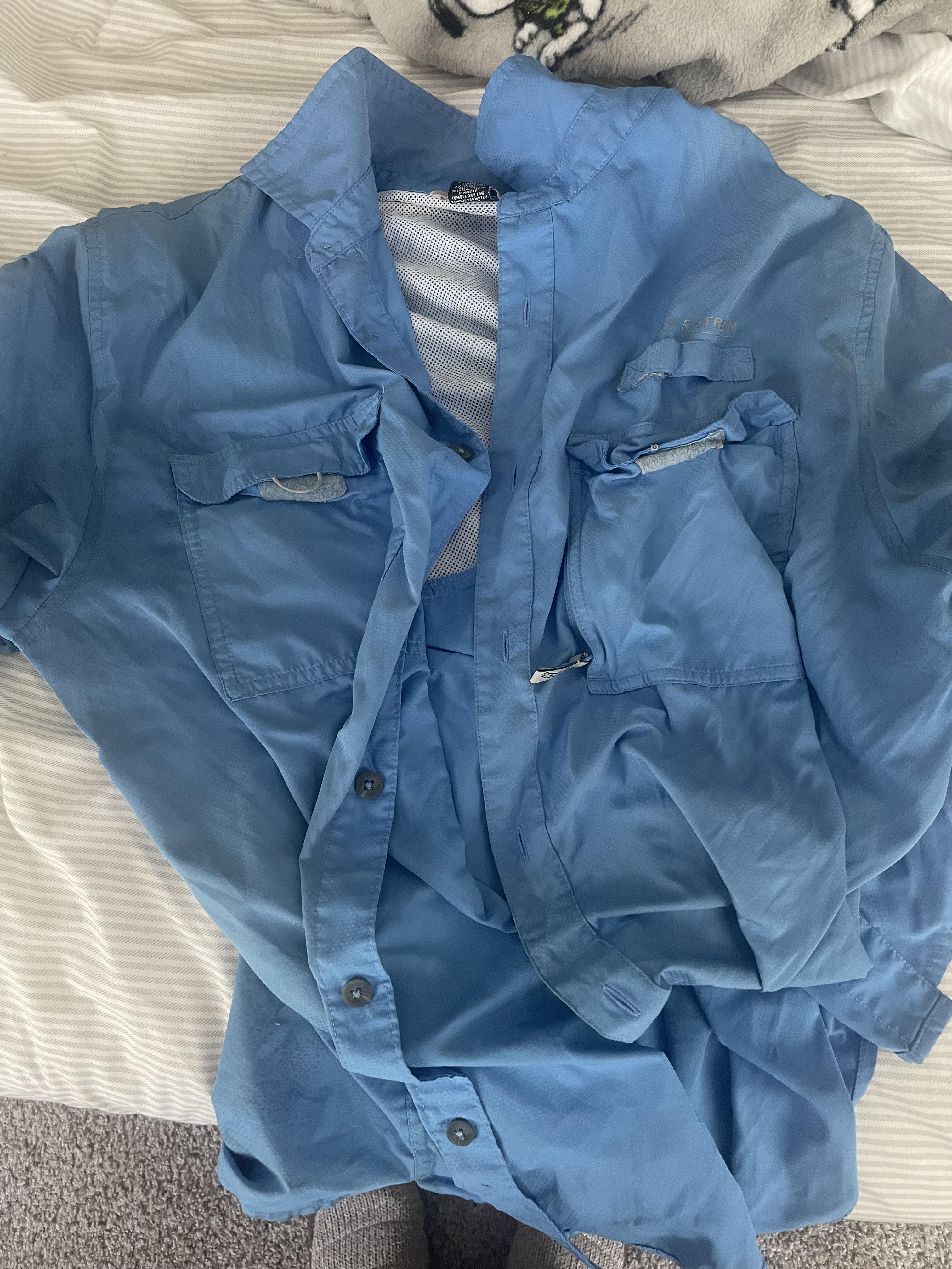 How do I clean these polyester shirts that stink even after washing? It