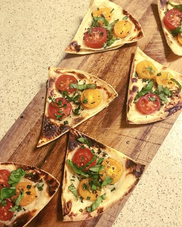 Snack time grilled tortilla with laughing cow; cherry tomatoes