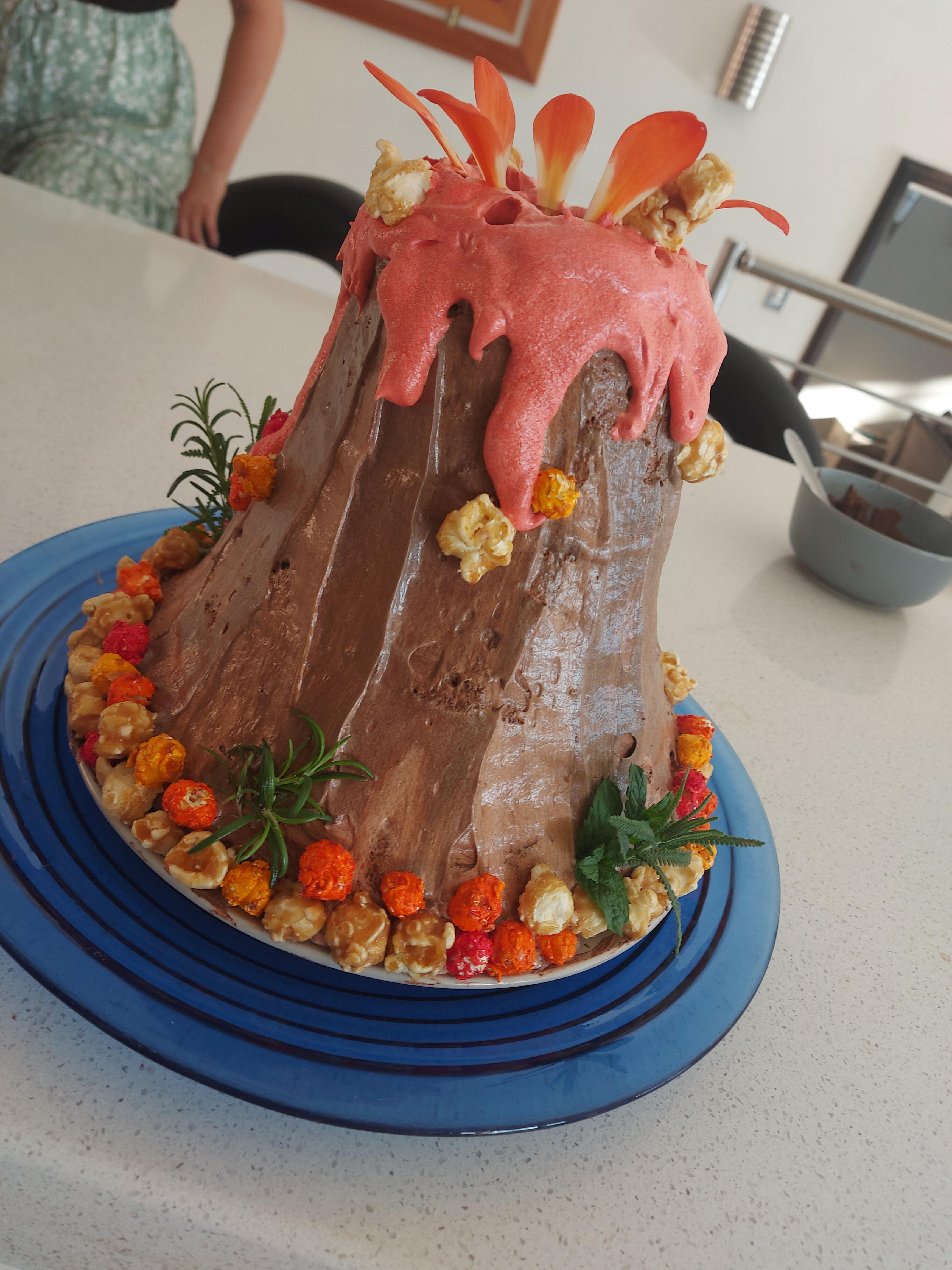 A volcano cake I made for my younger brothers birthday 🌋 r/cakedecorating