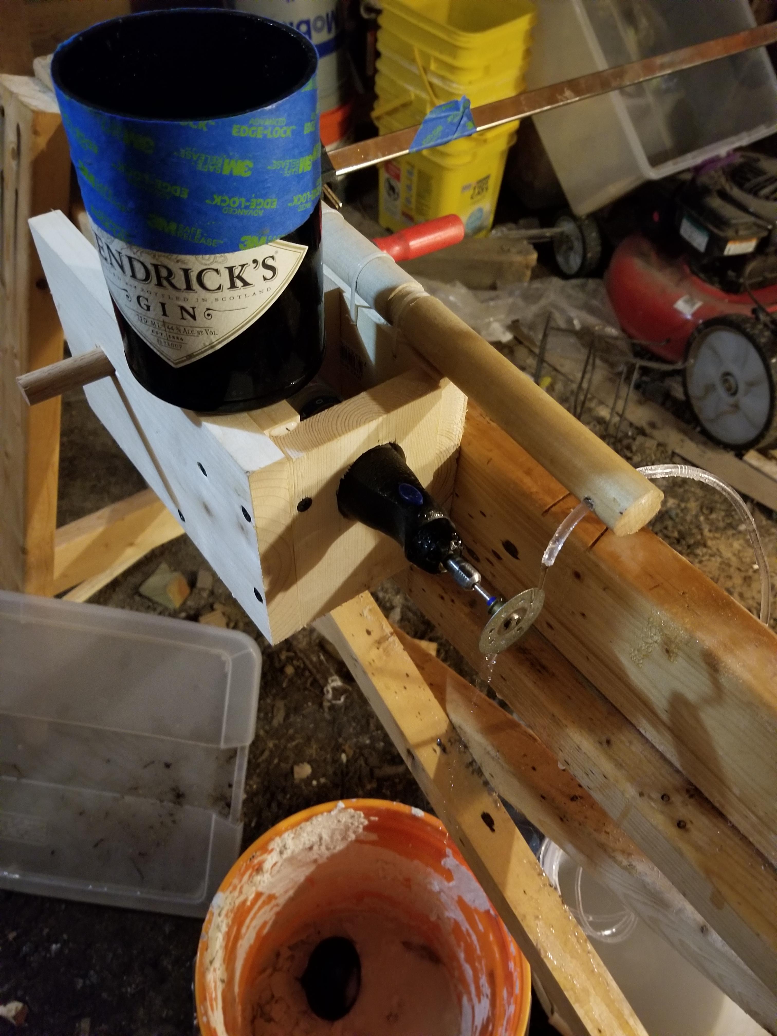 Made a bottle cutter, upcycled a kitty litter tub as a water reservoir
