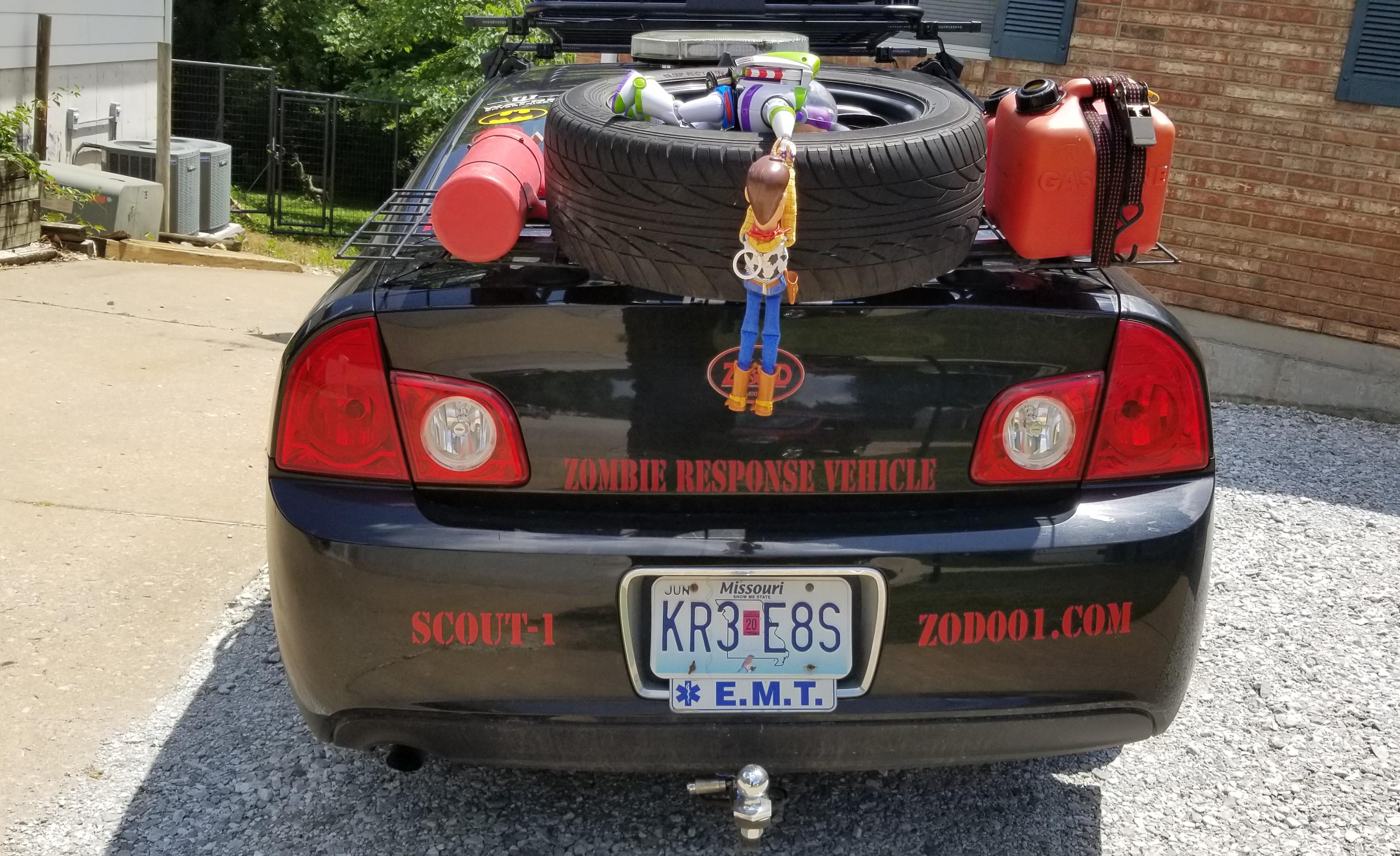 BUZZ helping WOODY up over the tire. "Don't let go. Woody" they are