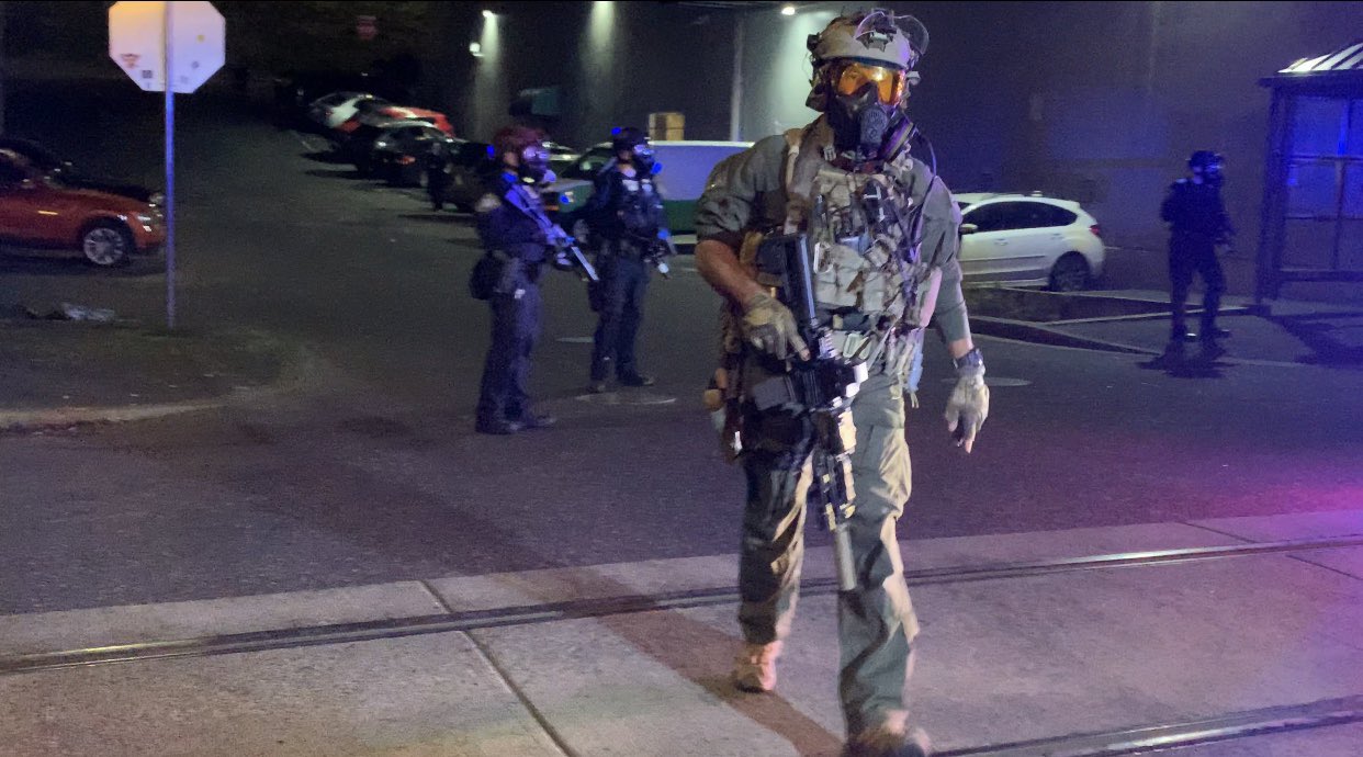 A United States Border Patrol BORTAC agent outside of an ICE facility