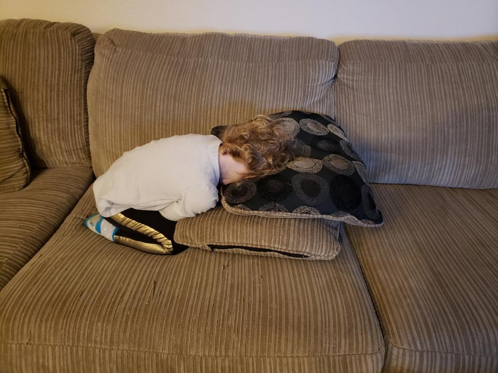 My 3 year old daughter passed out like this on the couch