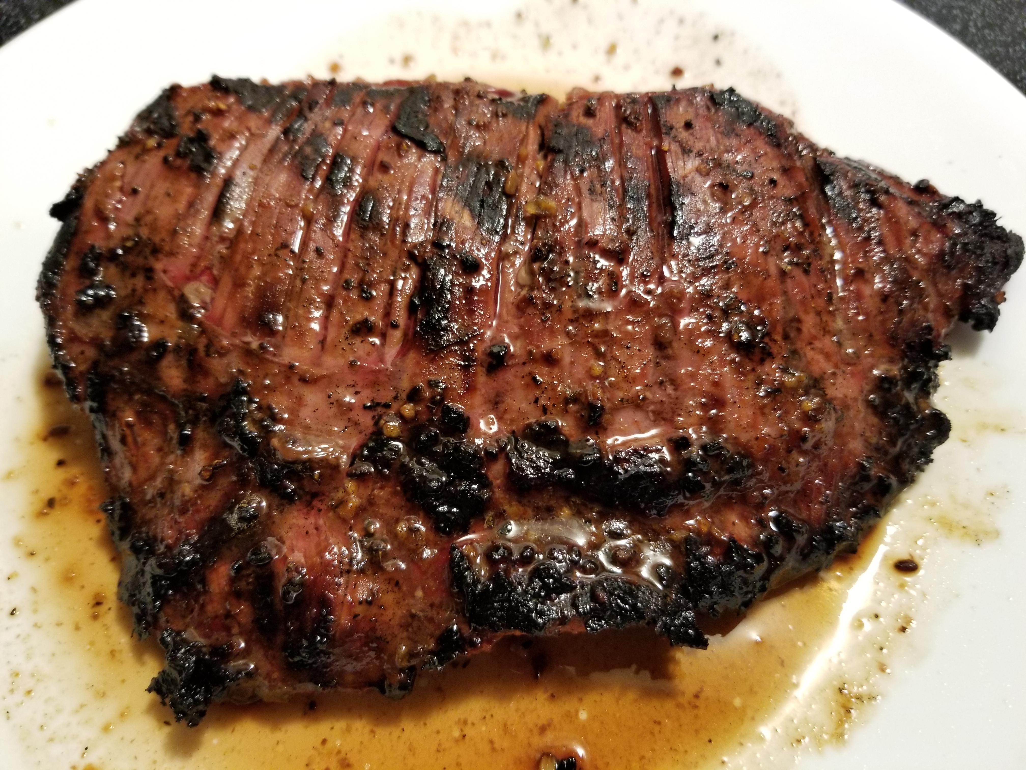 Perfectly Grilled Flank Steak Marinated in Dale's, Italian and topped