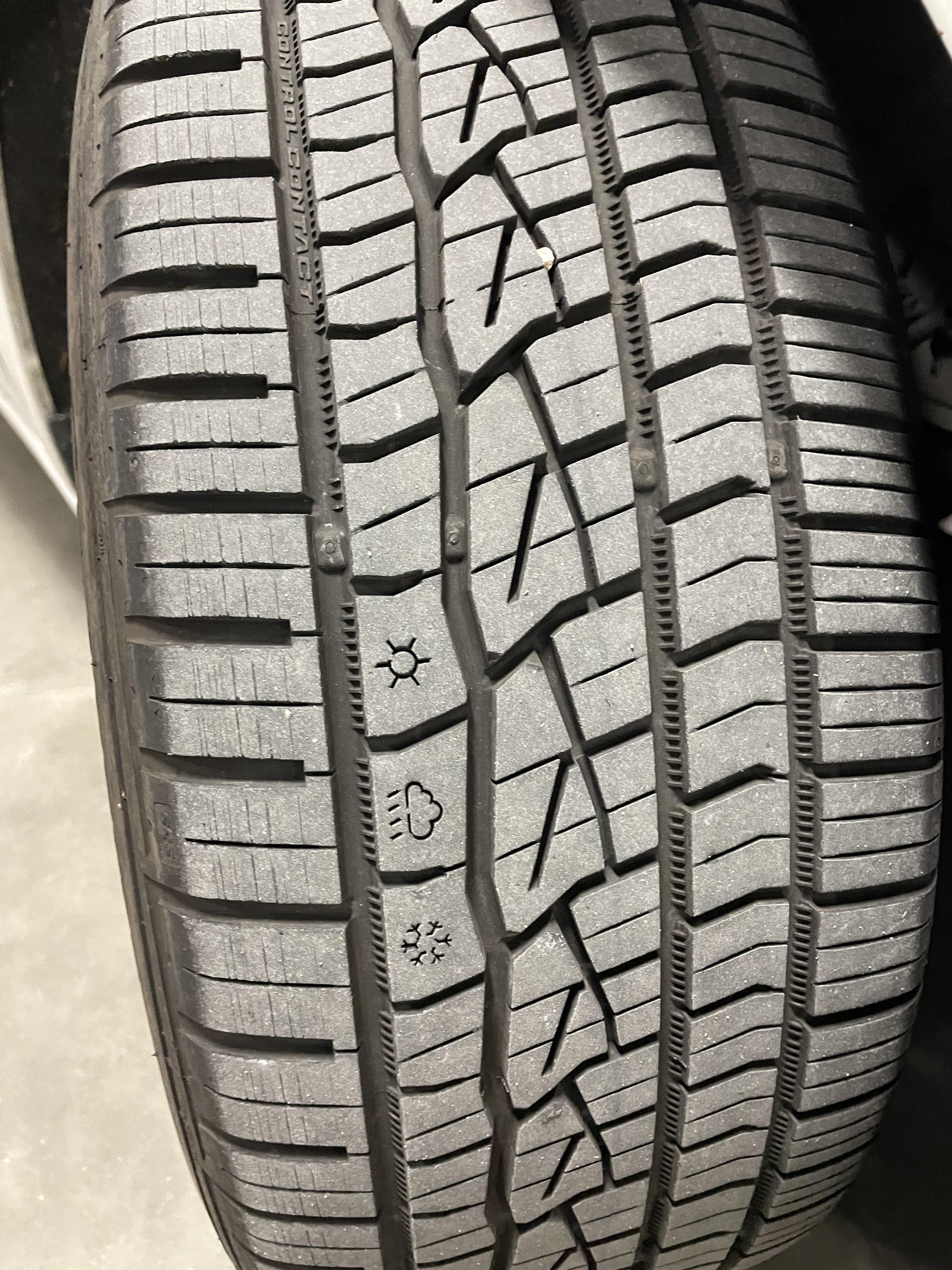 These tires have the picture of a sun, rain cloud, and snowflake