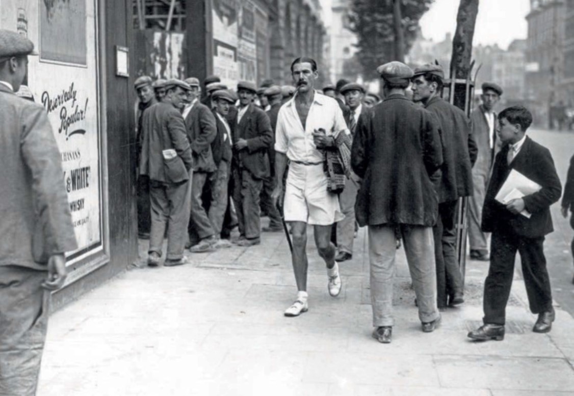 An enthusiast for Men’s dress reform walking down the Strand in London